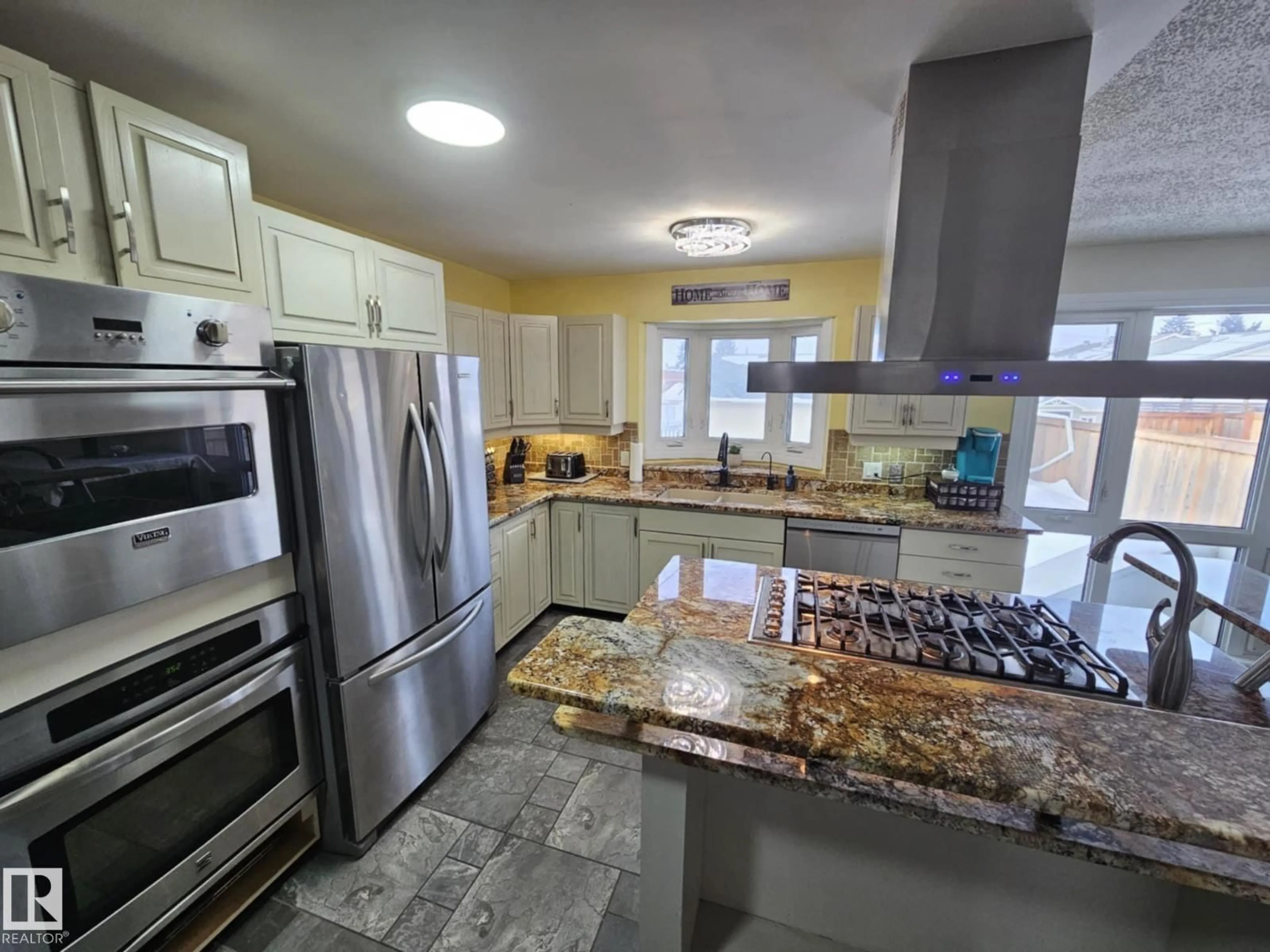 Open concept kitchen, ceramic/tile floor for 8512 131 AV, Edmonton Alberta T5E0W2