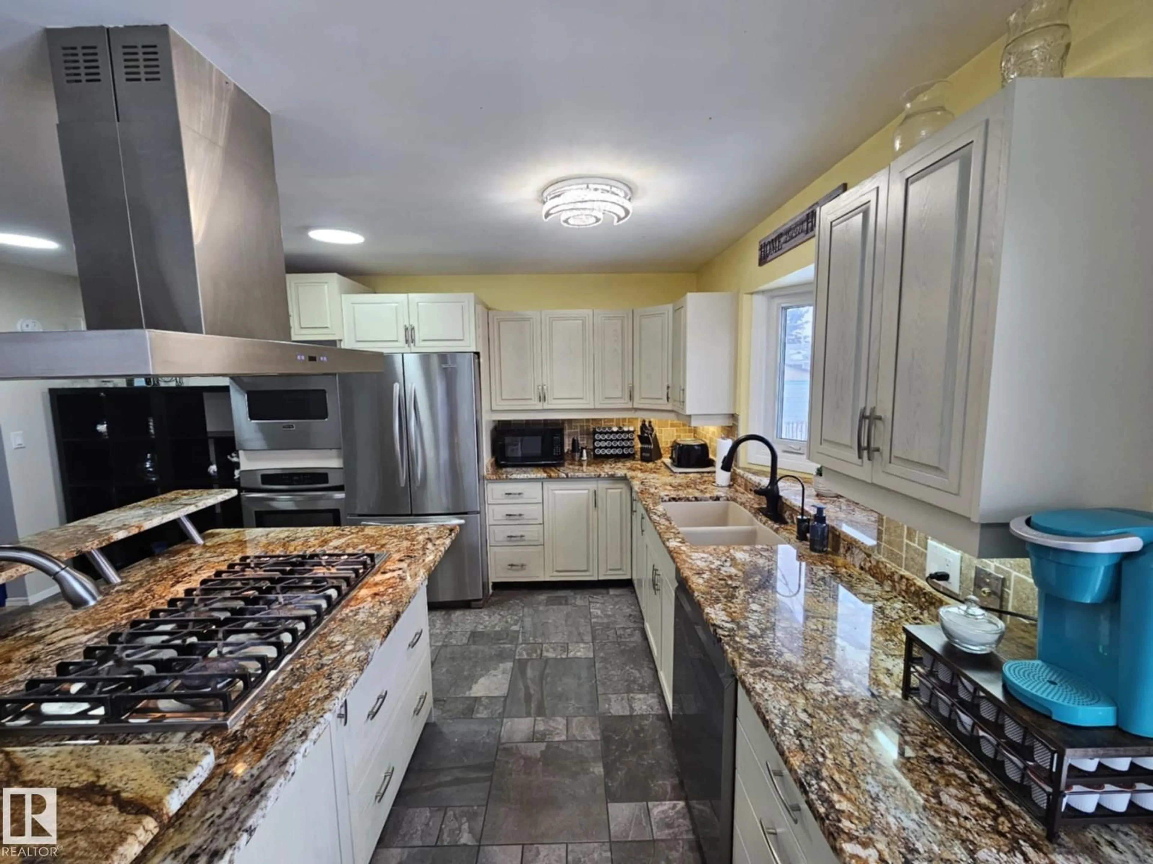 Open concept kitchen, ceramic/tile floor for 8512 131 AV, Edmonton Alberta T5E0W2