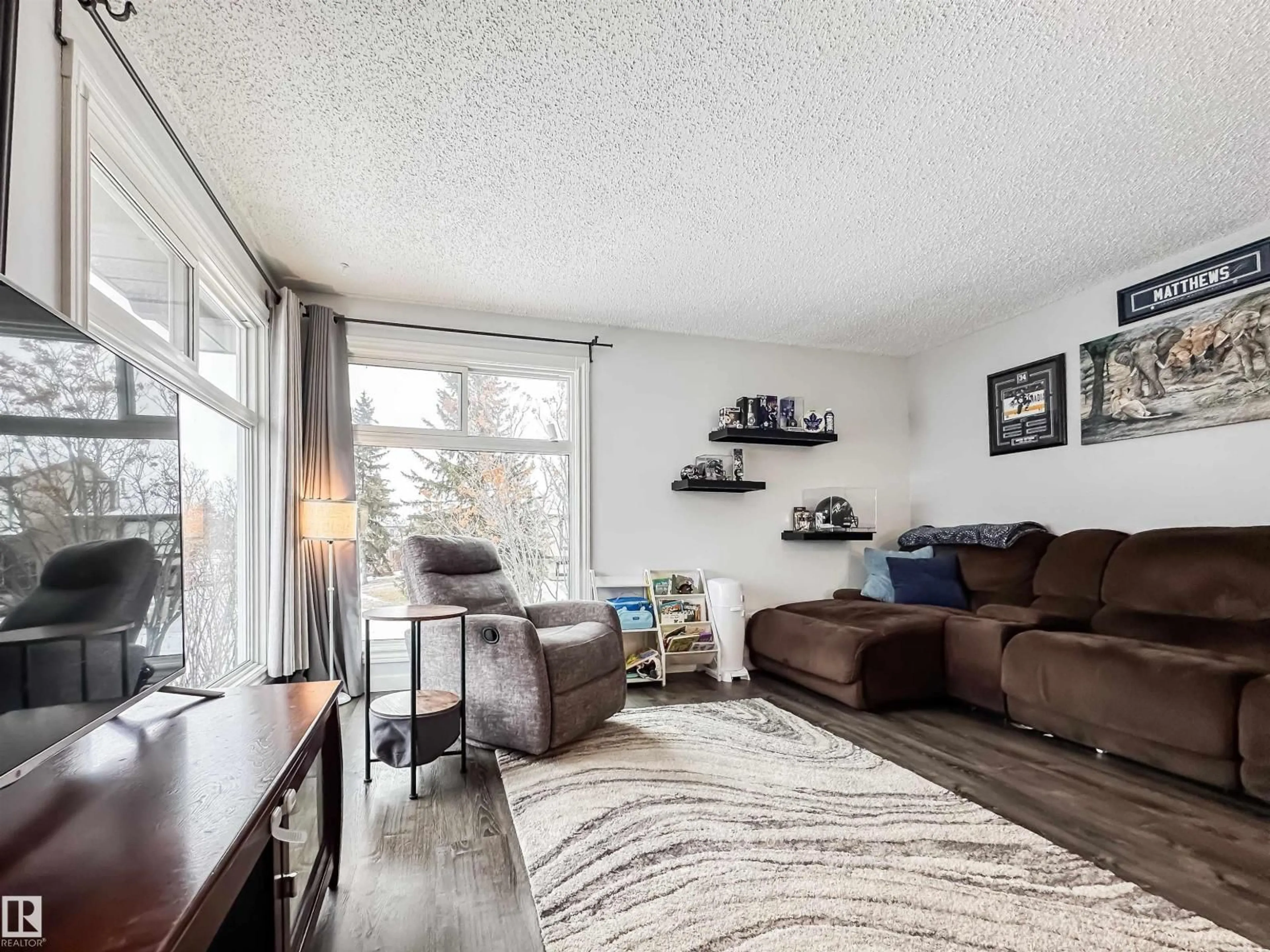 Living room with furniture, wood/laminate floor for NW - 3521 41B AV, Edmonton Alberta T6L5E6