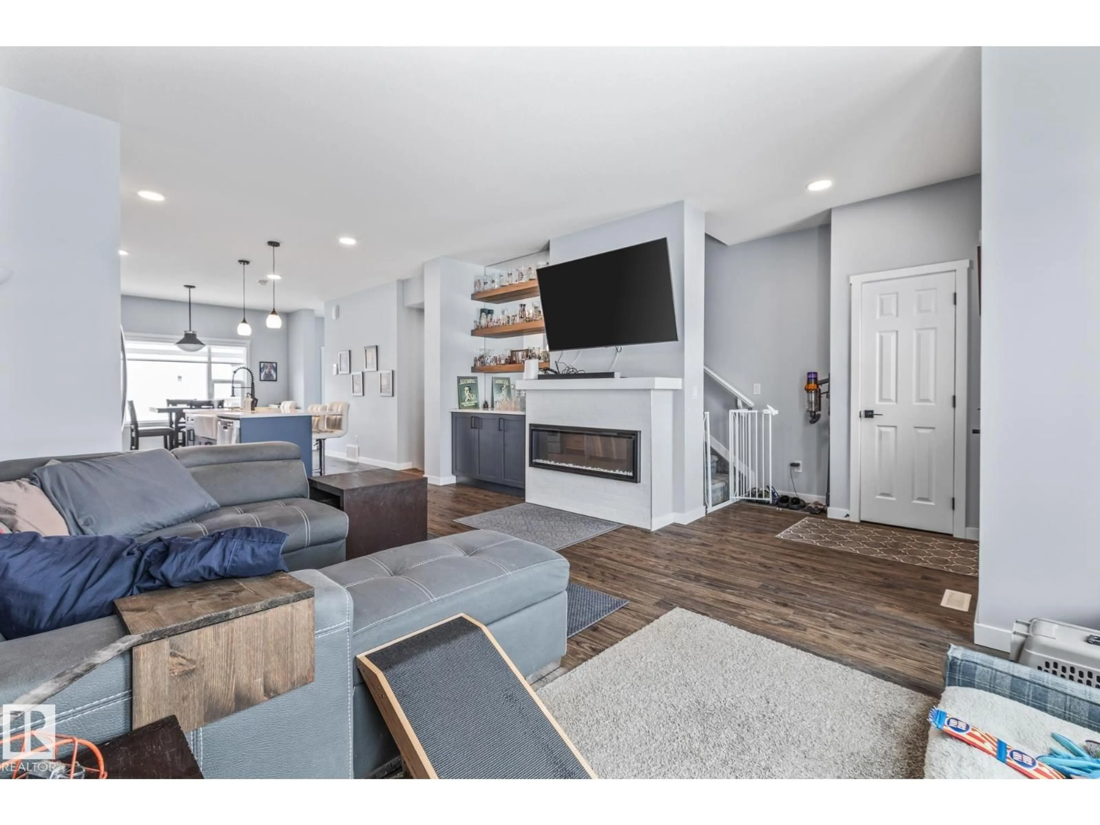 Living room with furniture, wood/laminate floor for 597 MEADOWVIEW DR, Fort Saskatchewan Alberta T8L0X1