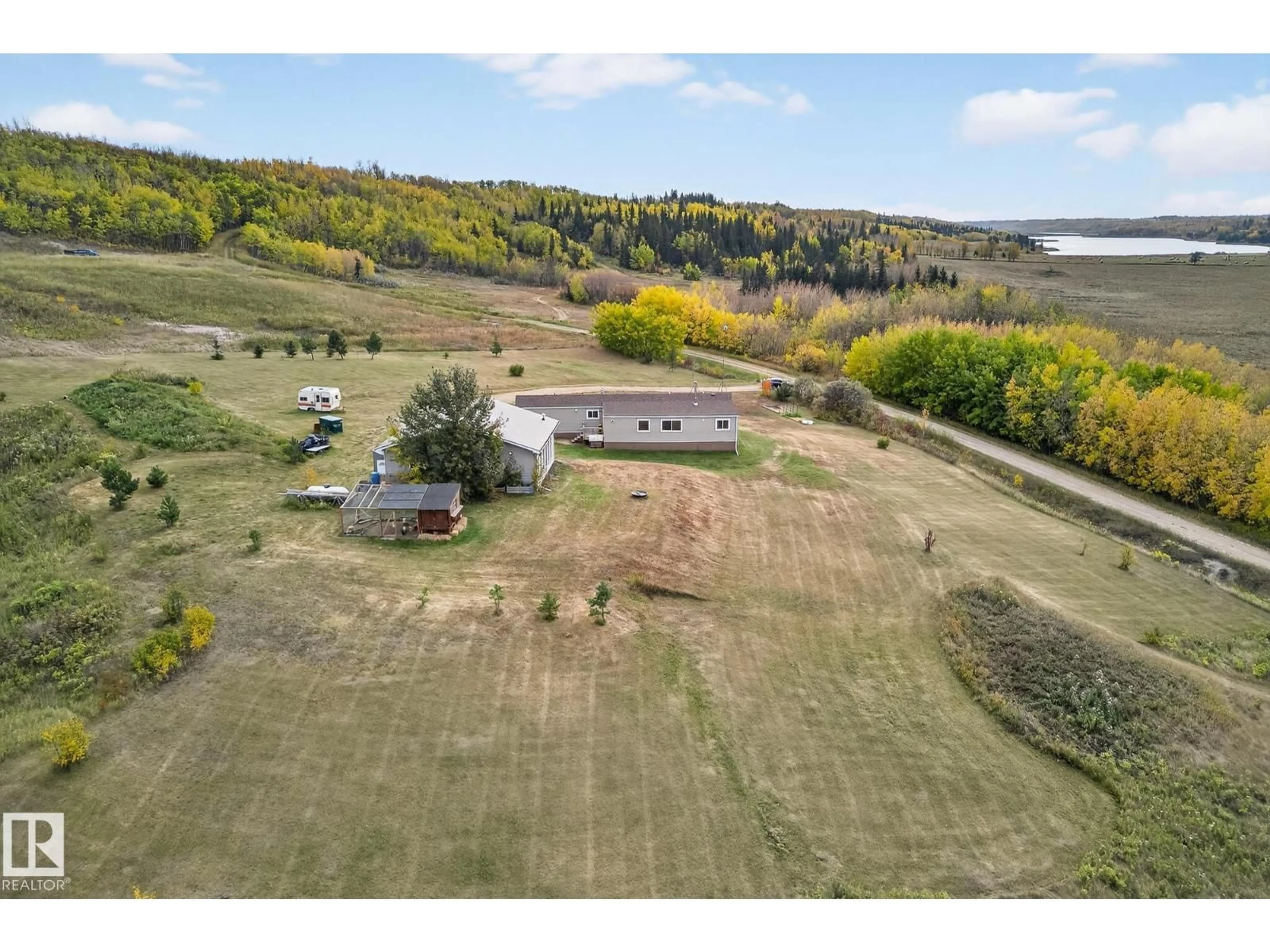 A pic from outside/outdoor area/front of a property/back of a property/a pic from drone, water/lake/river/ocean view for 23509A TWP ROAD 484, Rural Leduc County Alberta T0C1Z0