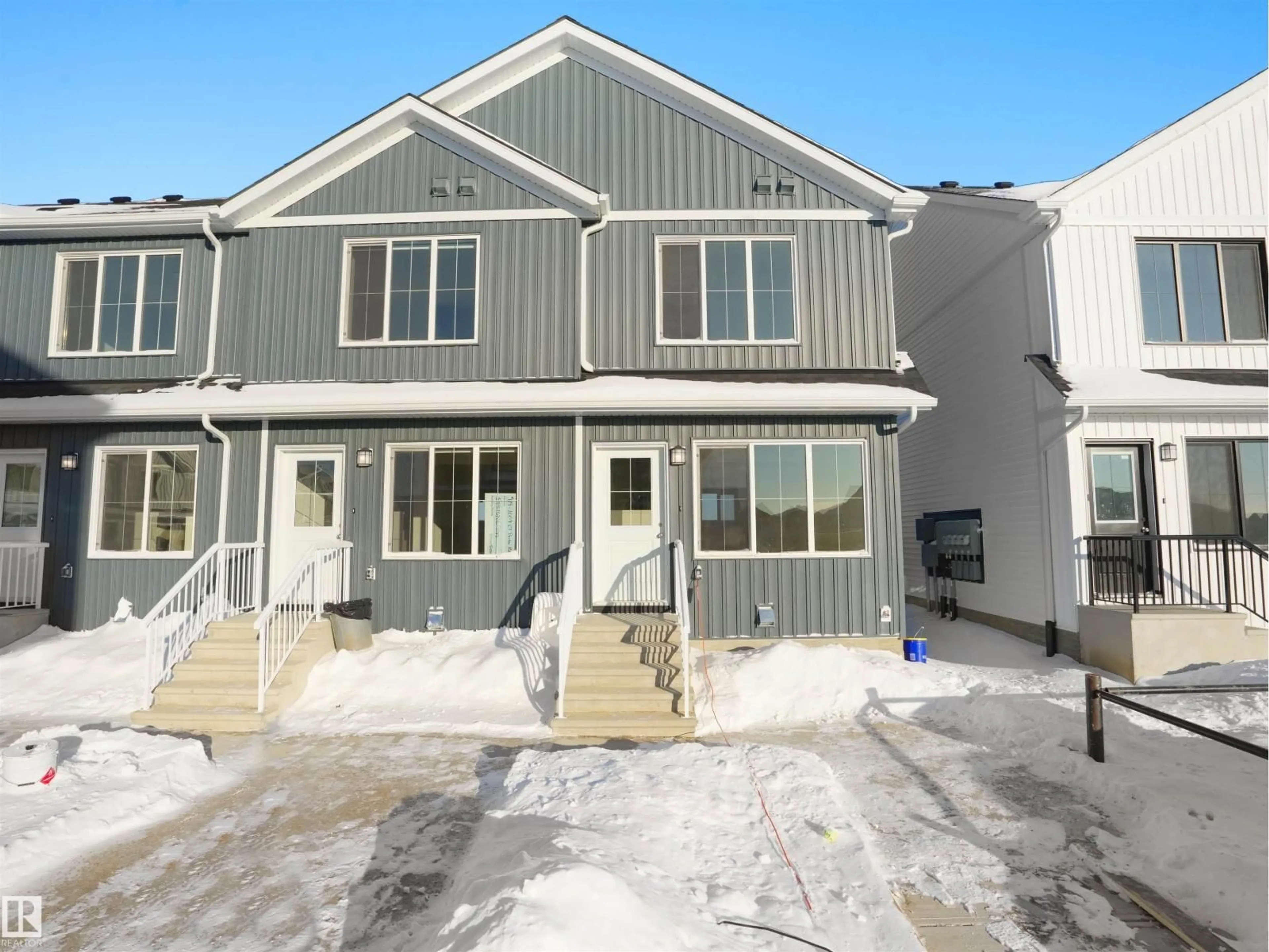 Home with vinyl exterior material, street for #118 - 1009 CY BECKER RD, Edmonton Alberta T5Y4B7