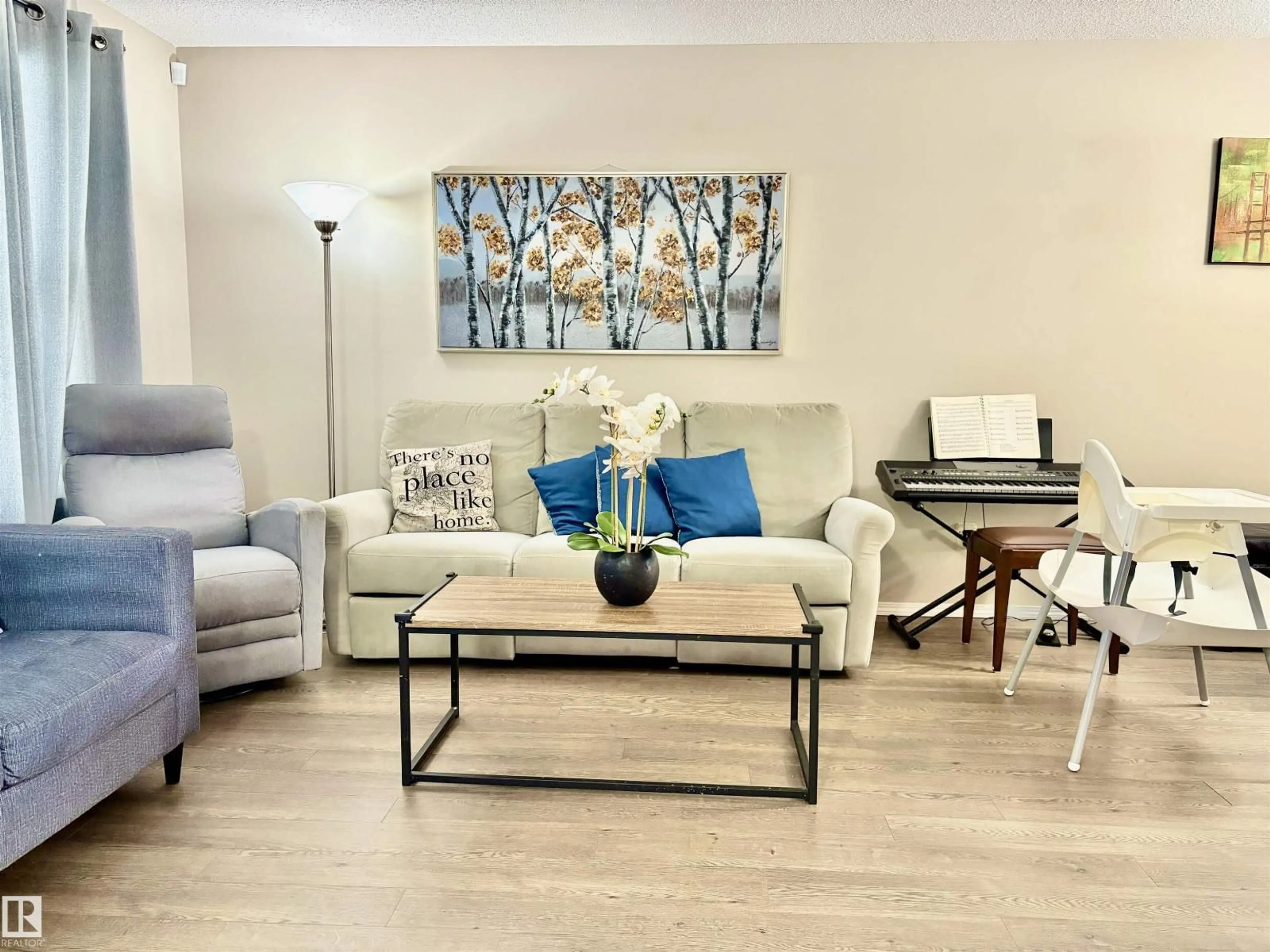 Living room with furniture, wood/laminate floor for SW - 2344 71 ST, Edmonton Alberta T6X1Z1