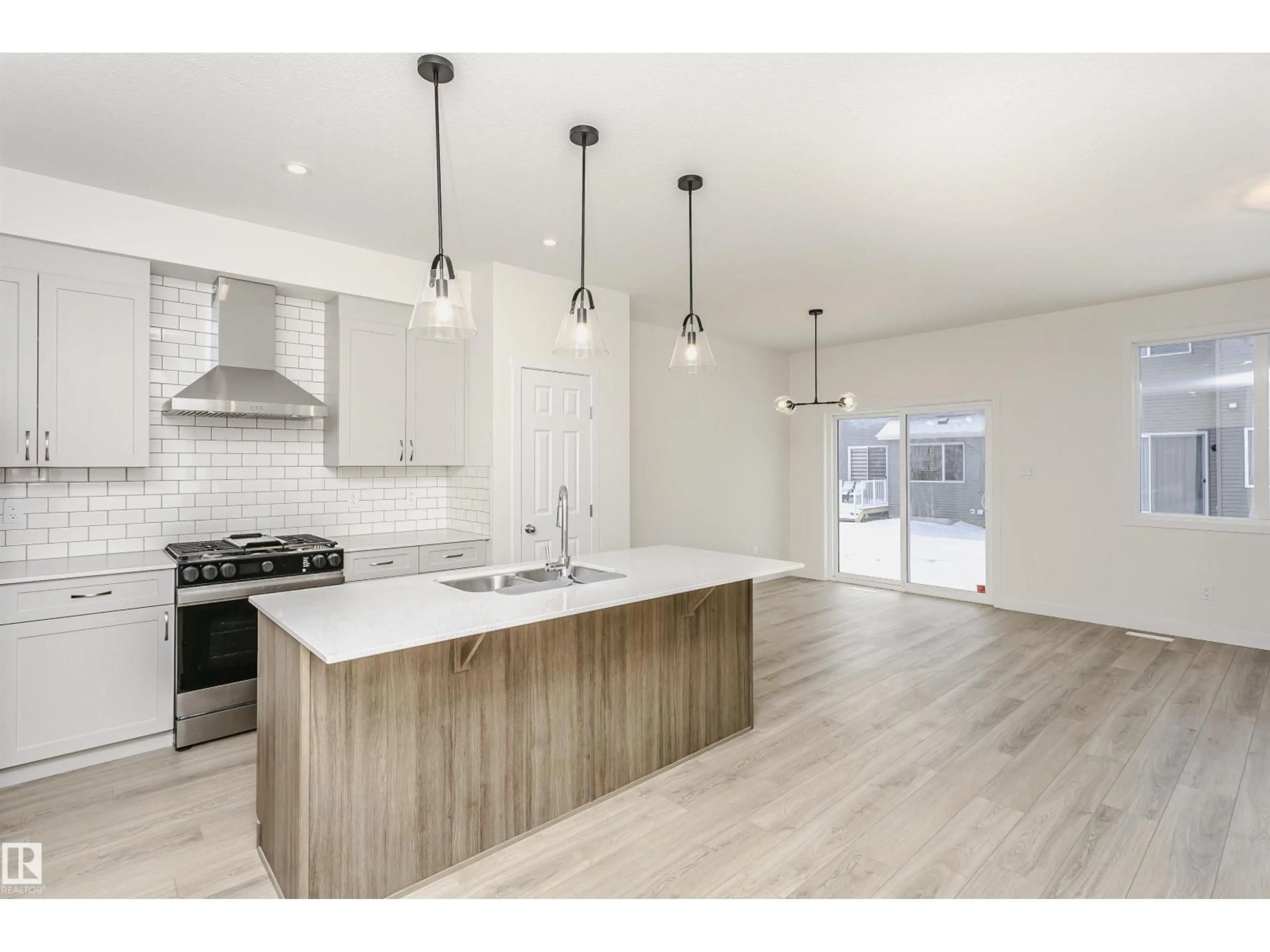 Open concept kitchen, wood/laminate floor for 5111 KINNEY WY, Edmonton Alberta T6W5N9