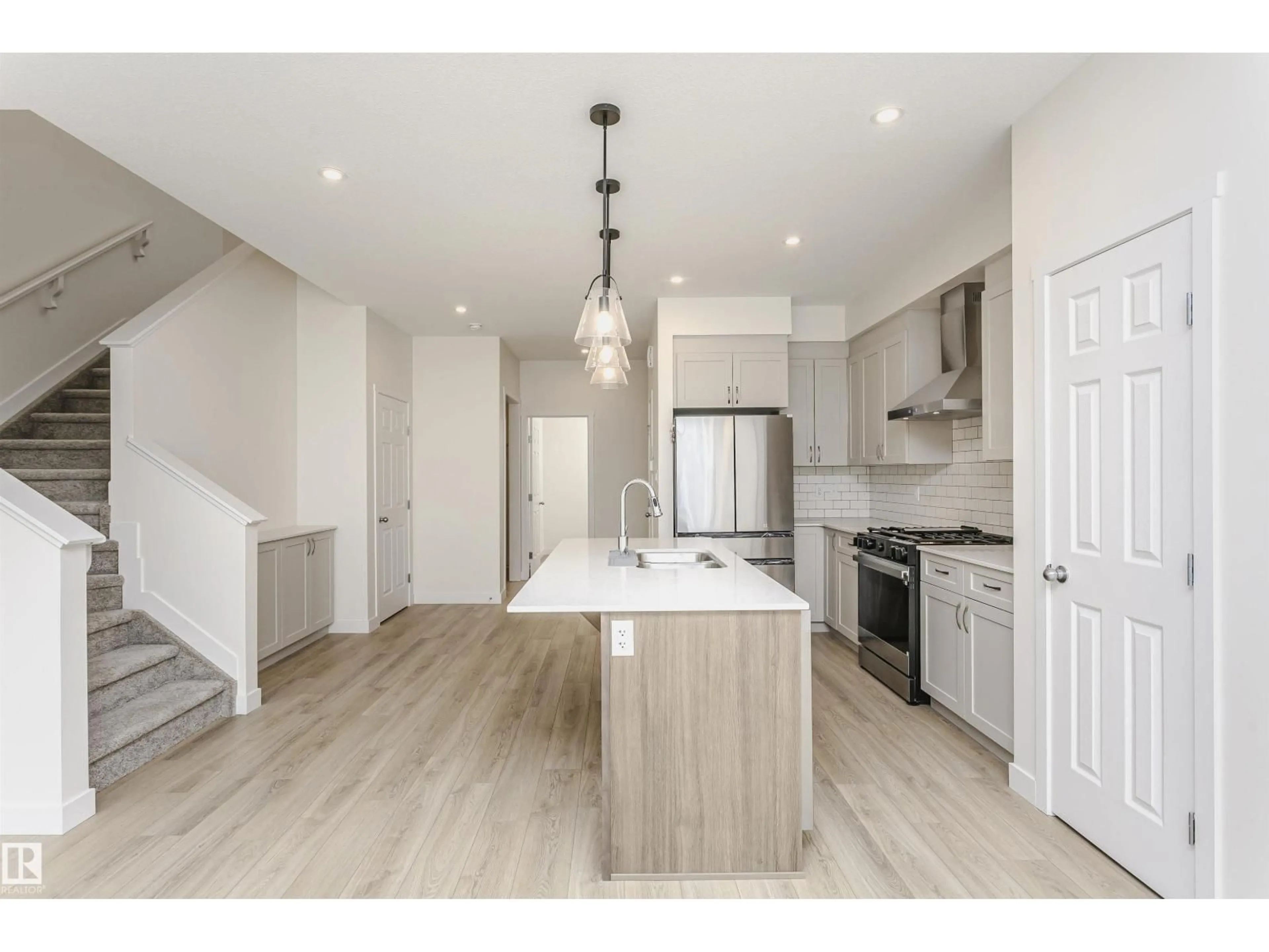 Open concept kitchen, wood/laminate floor for 5111 KINNEY WY, Edmonton Alberta T6W5N9