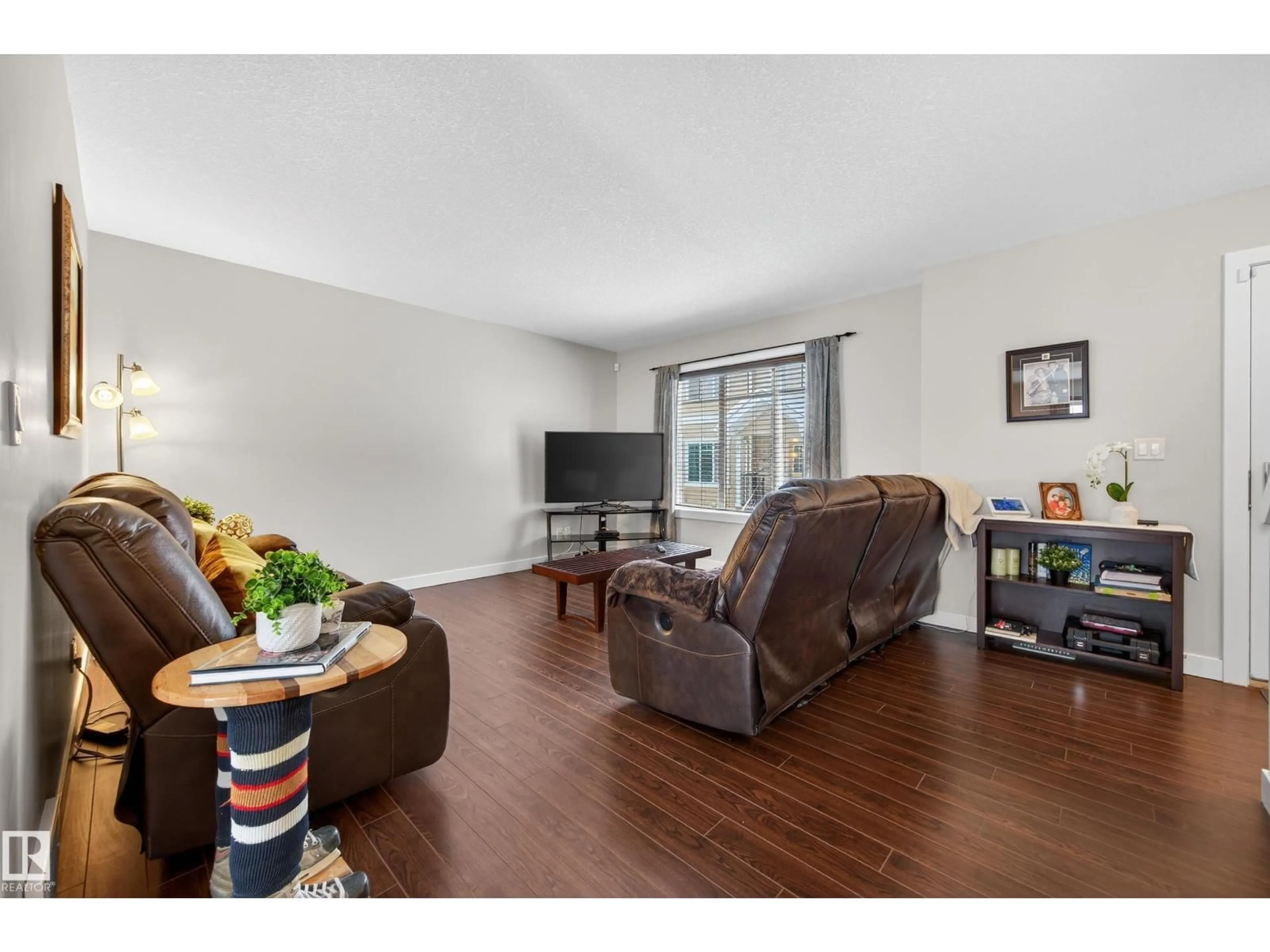 Living room with furniture, wood/laminate floor for 5134 - 20 MULLEN RD, Edmonton Alberta T6R0S7