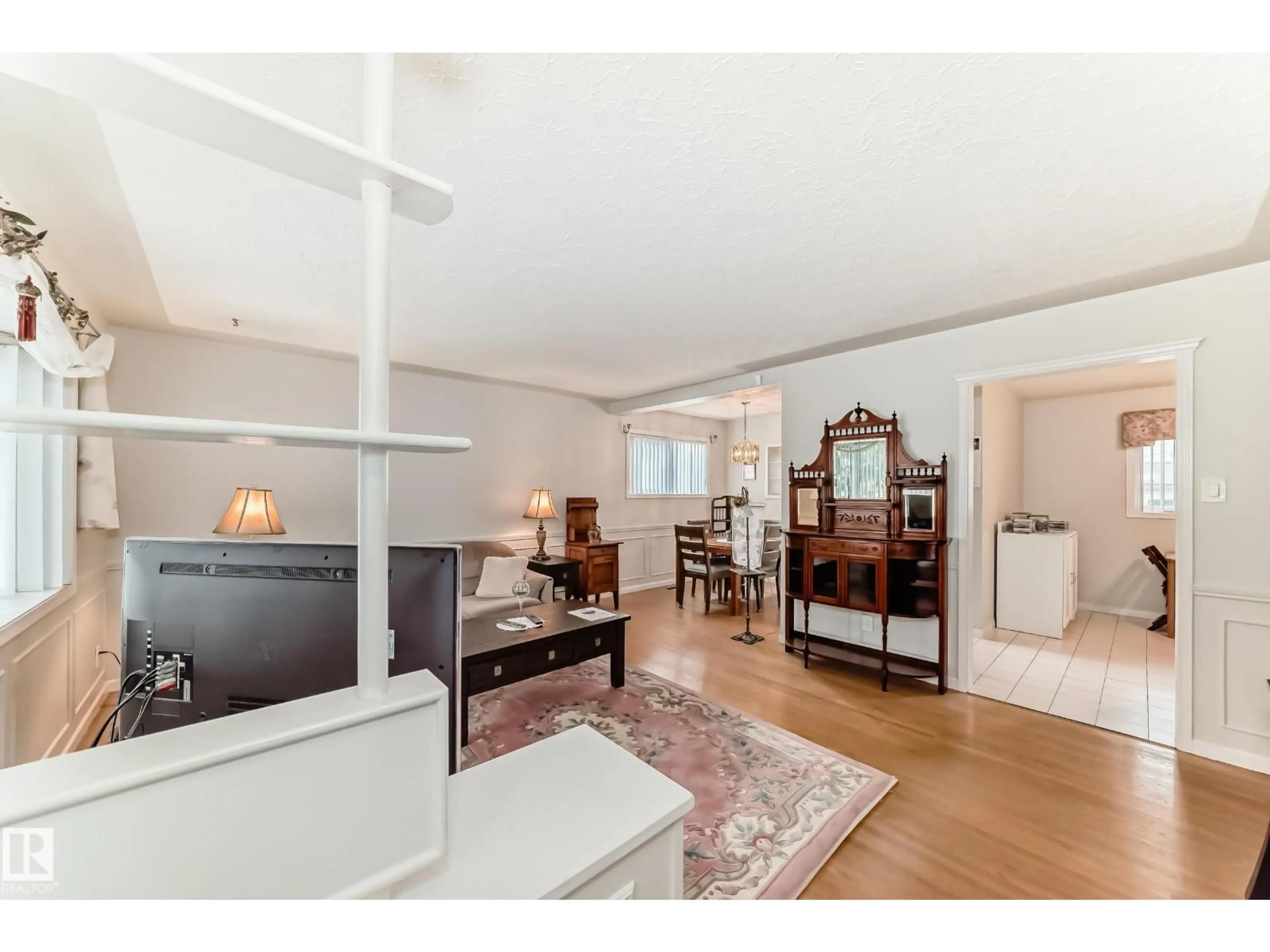 Living room with furniture, wood/laminate floor for NW - 8602 158 ST, Edmonton Alberta T5R2C4