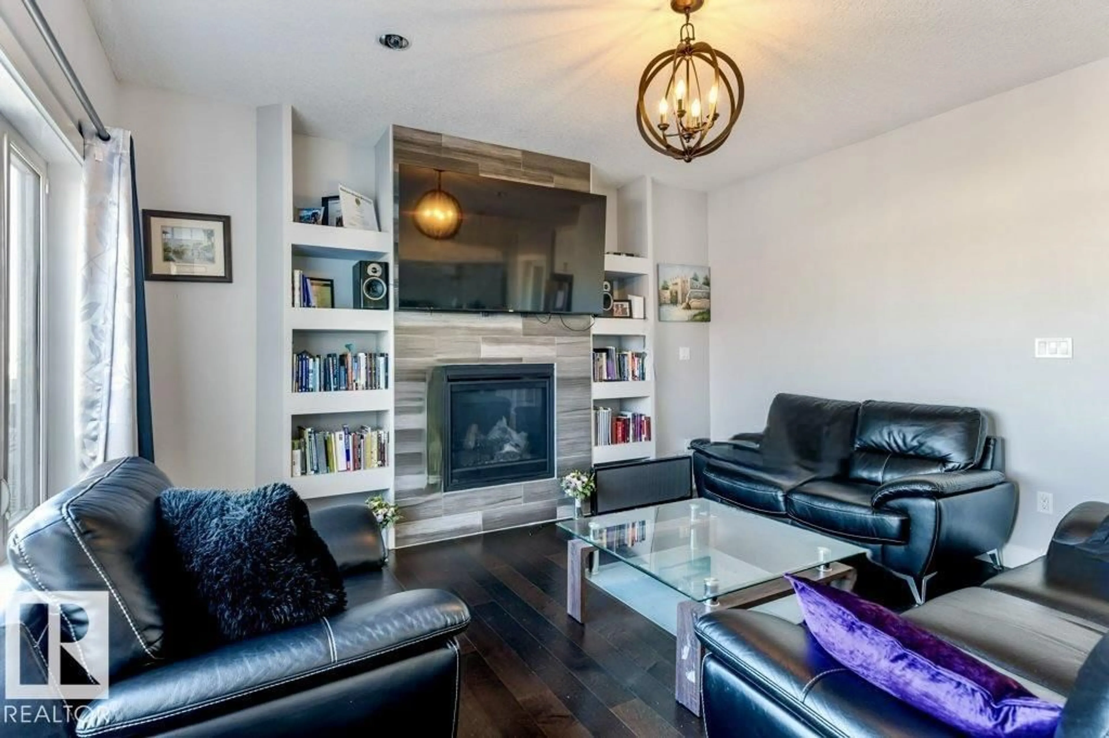 Living room with furniture, wood/laminate floor for 4452 6 ST, Edmonton Alberta T6T0Z8