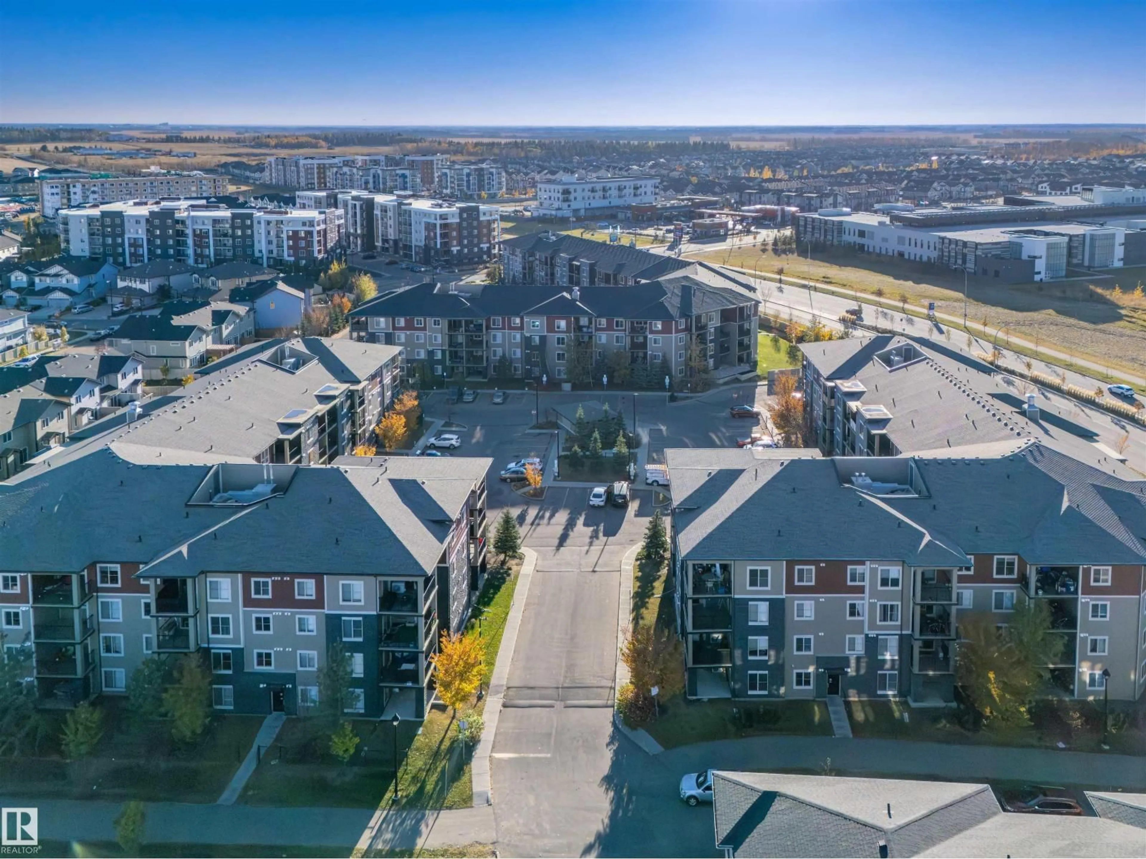 A pic from outside/outdoor area/front of a property/back of a property/a pic from drone, city buildings view from balcony for #206 - 3207 JAMES MOWATT TR, Edmonton Alberta T6W3L6