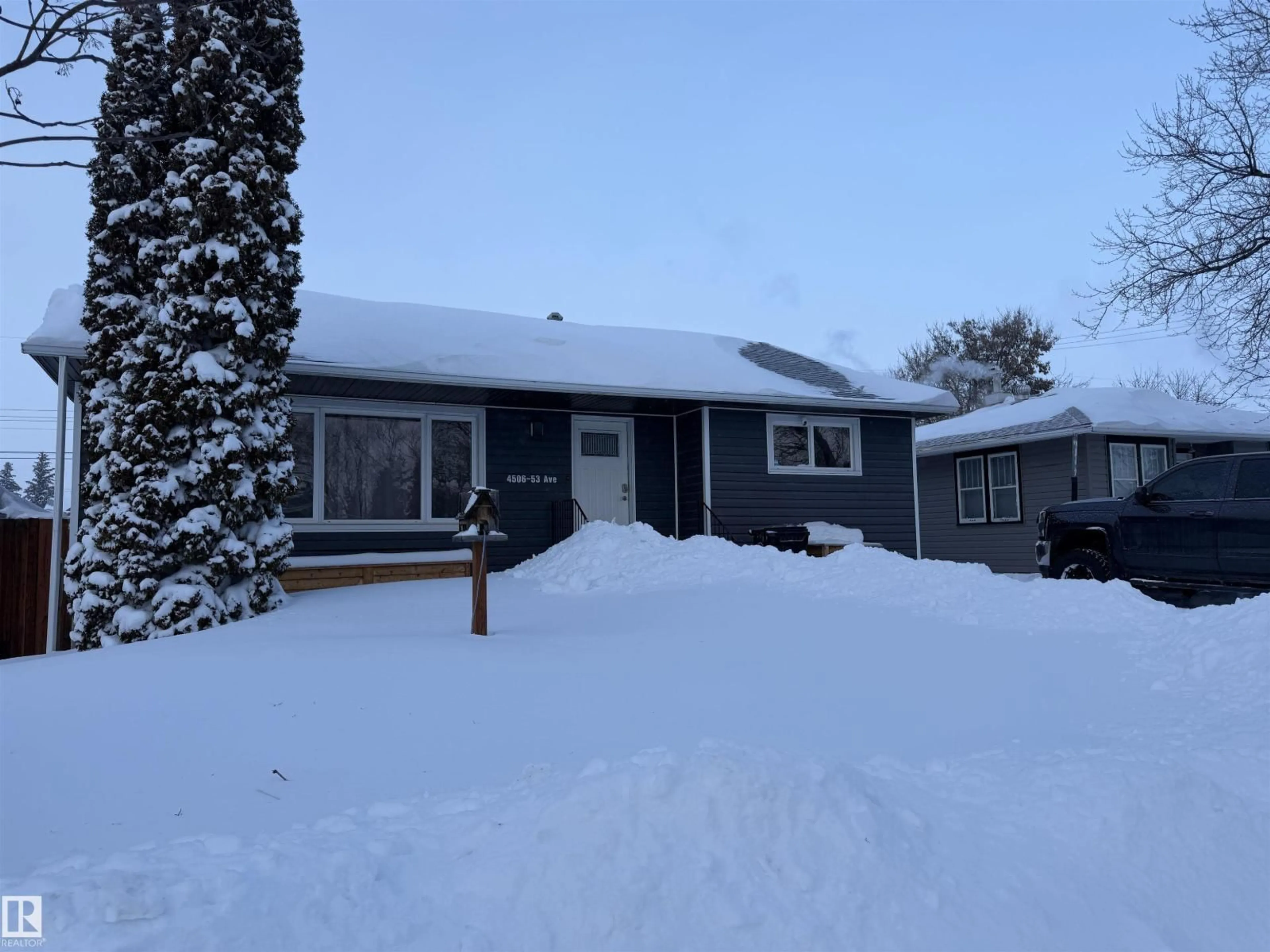 Home with vinyl exterior material, street for 4506 53 AVENUE, Barrhead Alberta T7N1A1