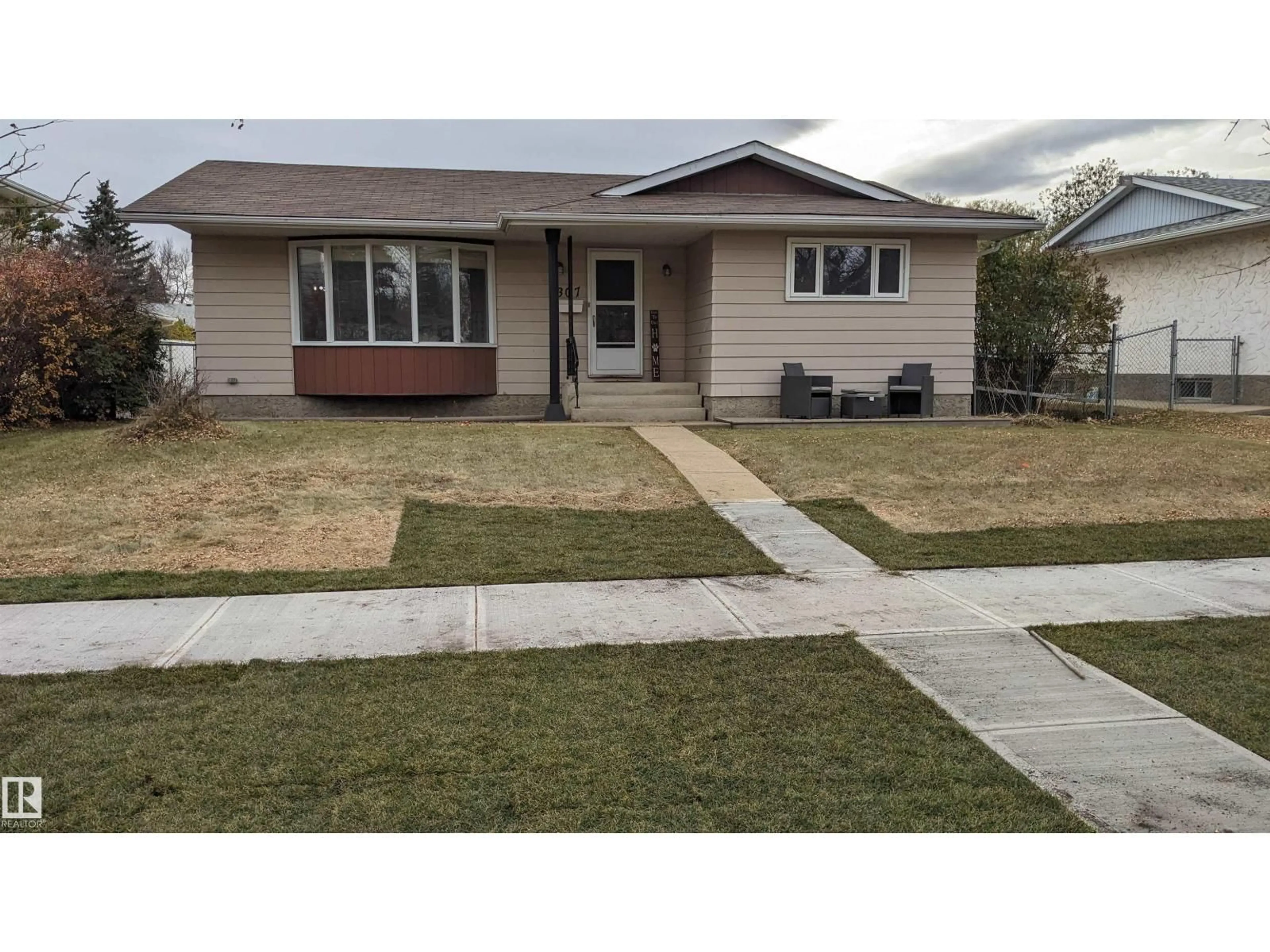 Home with vinyl exterior material, street for 6307 MARLER DR, Camrose Alberta T4V2Y6