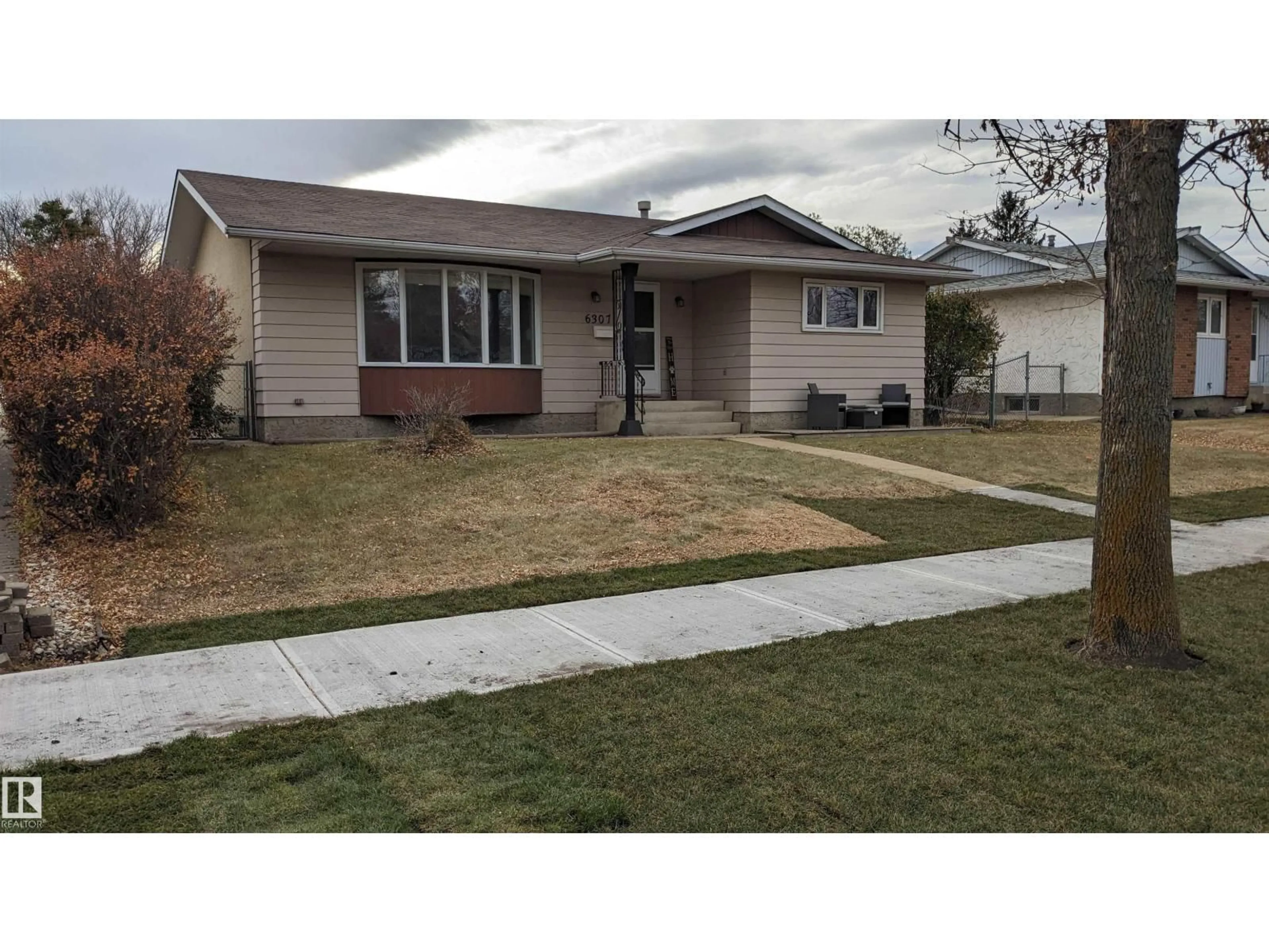 Home with vinyl exterior material, street for 6307 MARLER DR, Camrose Alberta T4V2Y6