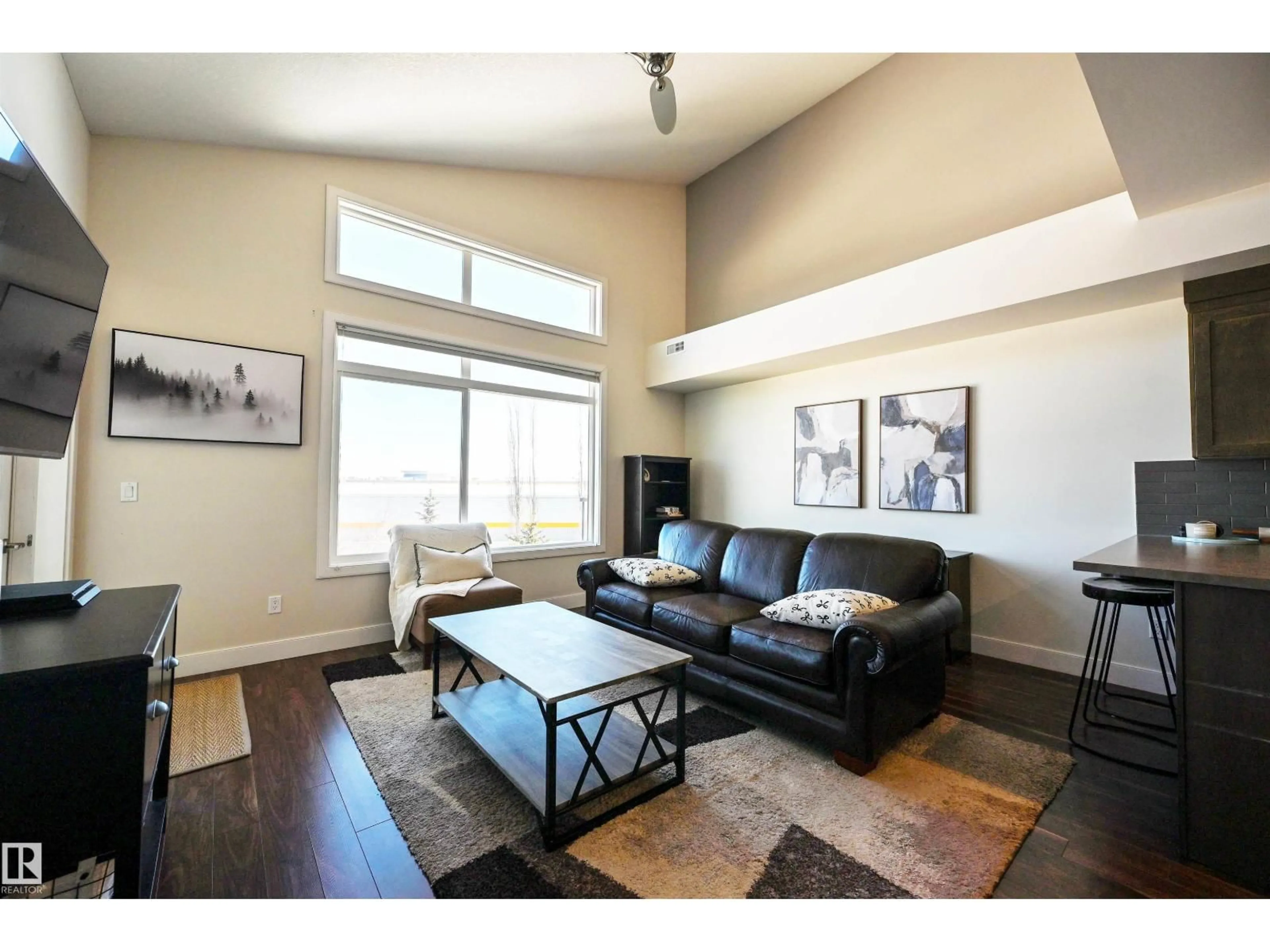 Living room with furniture, wood/laminate floor for 302 - 279 WYE RD, Sherwood Park Alberta T8B0A7