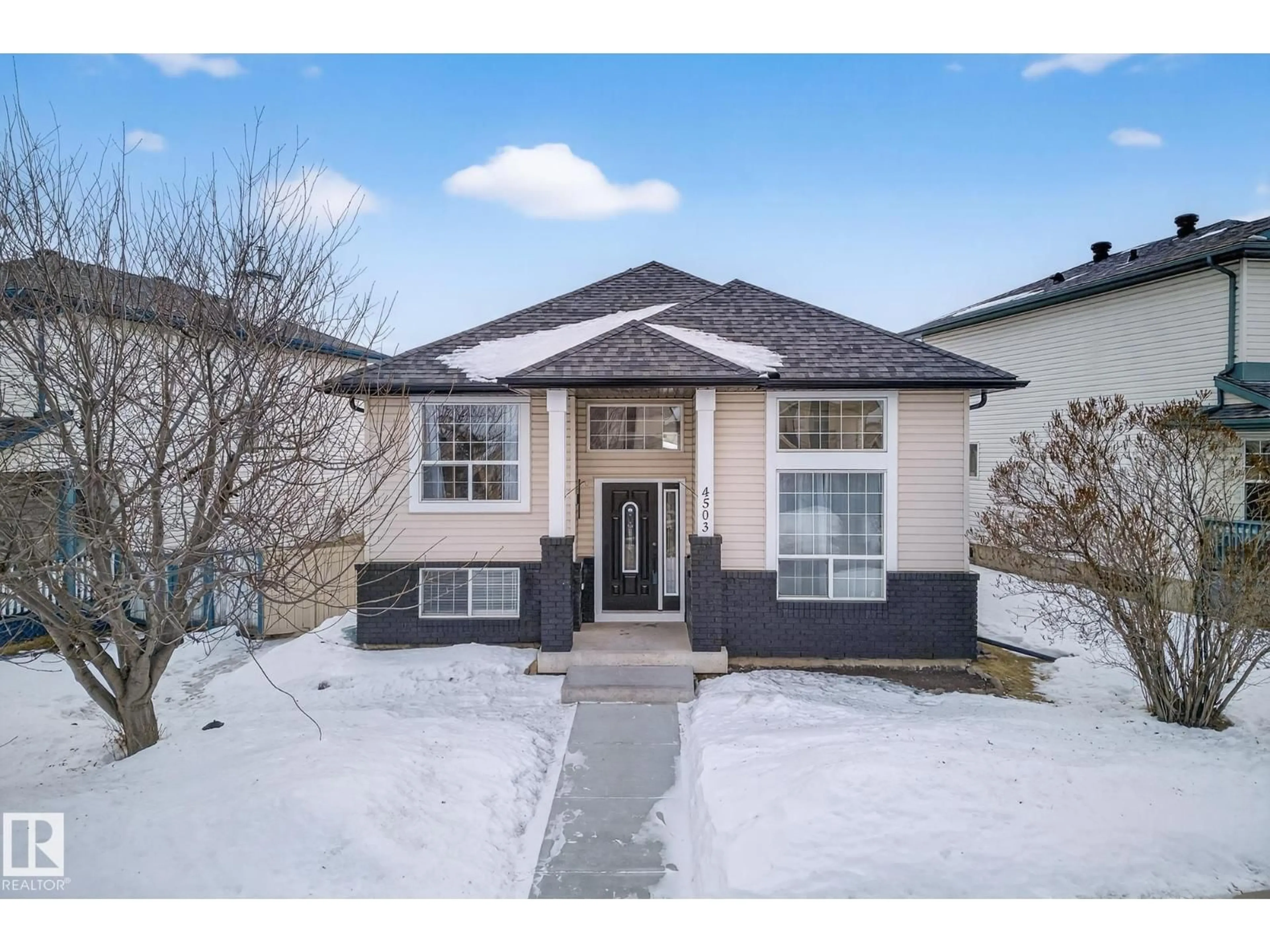 Home with brick exterior material, street for NW - 4503 149 AV, Edmonton Alberta T5Y2Y9