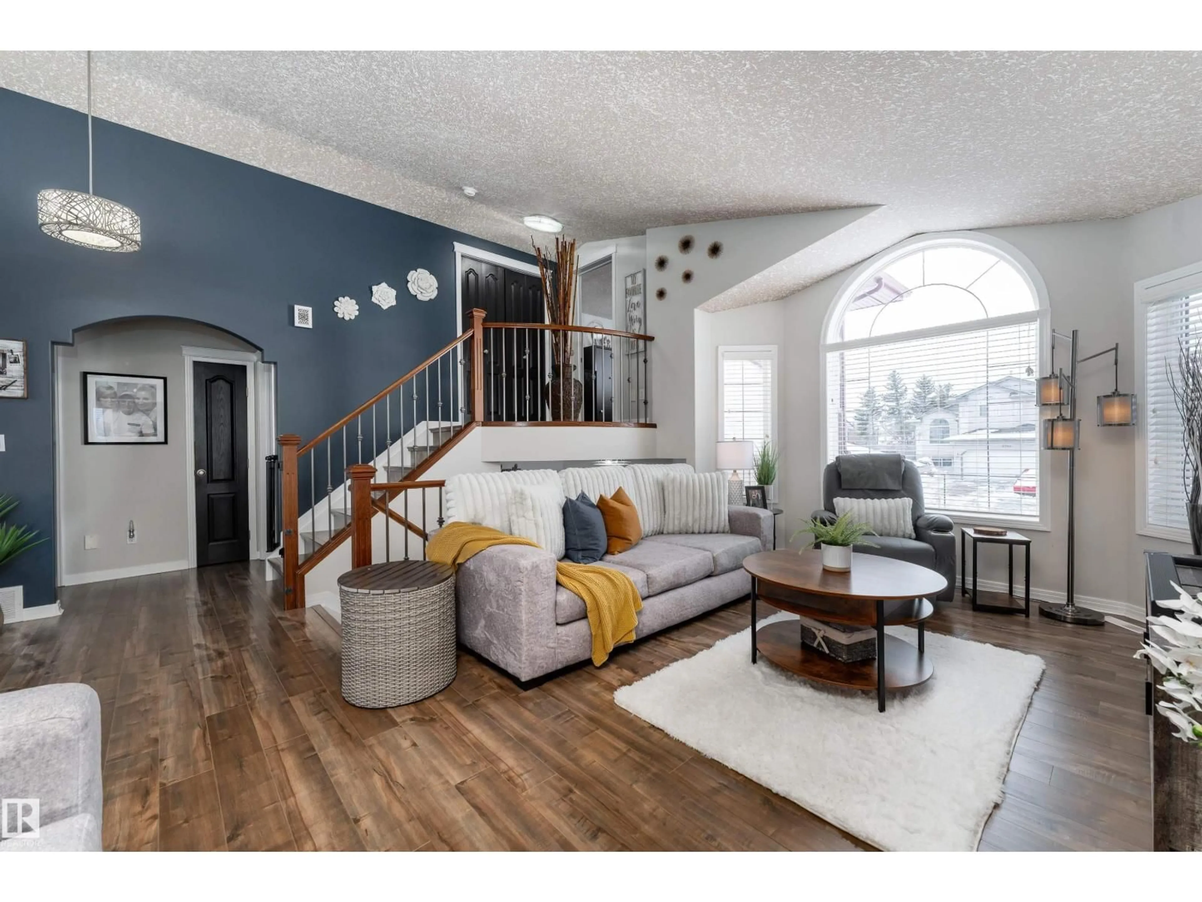 Living room with furniture, wood/laminate floor for 5709 45 ST, Tofield Alberta T0B4J0