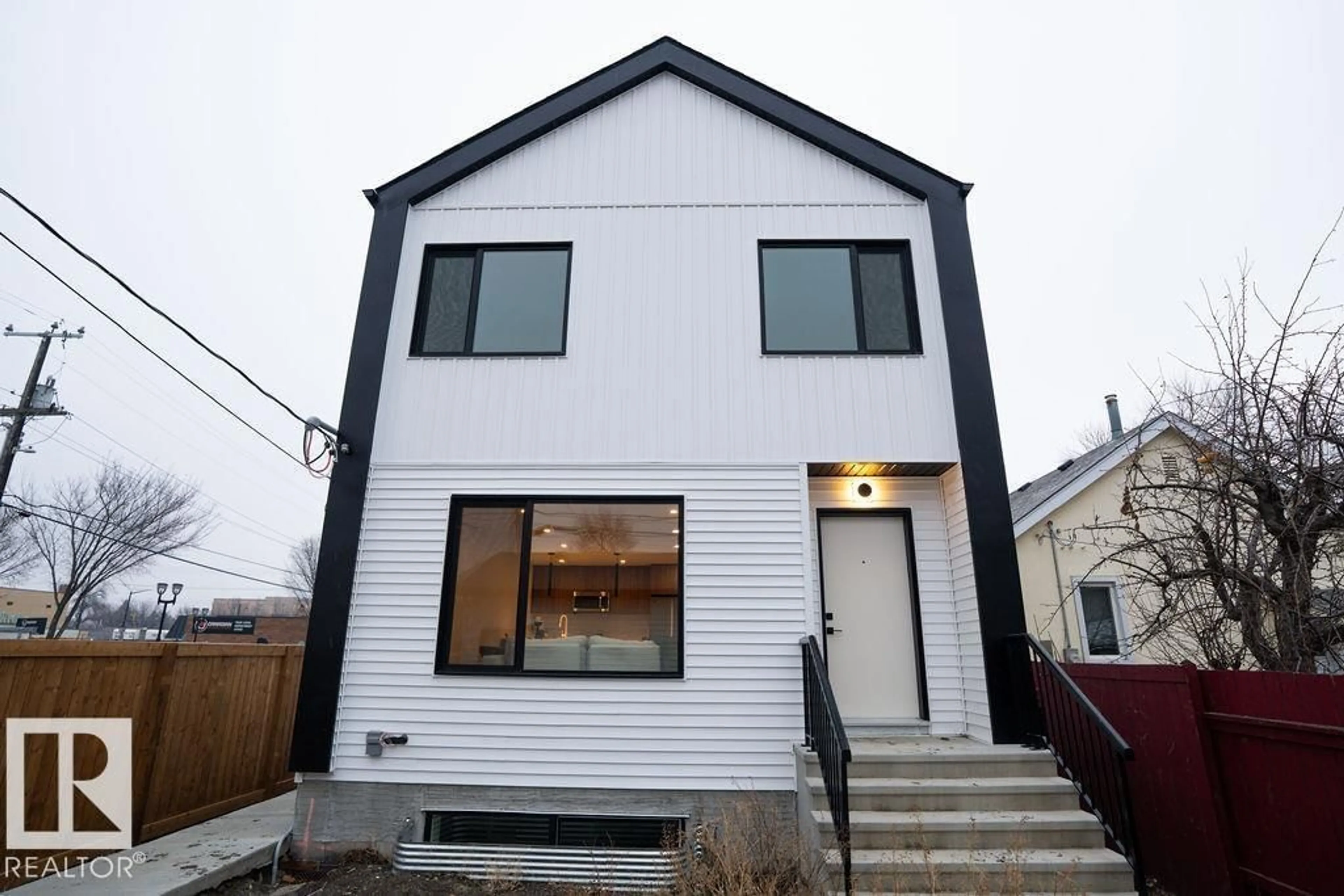 Home with vinyl exterior material, street for 11738 91 ST, Edmonton Alberta T5B4B3