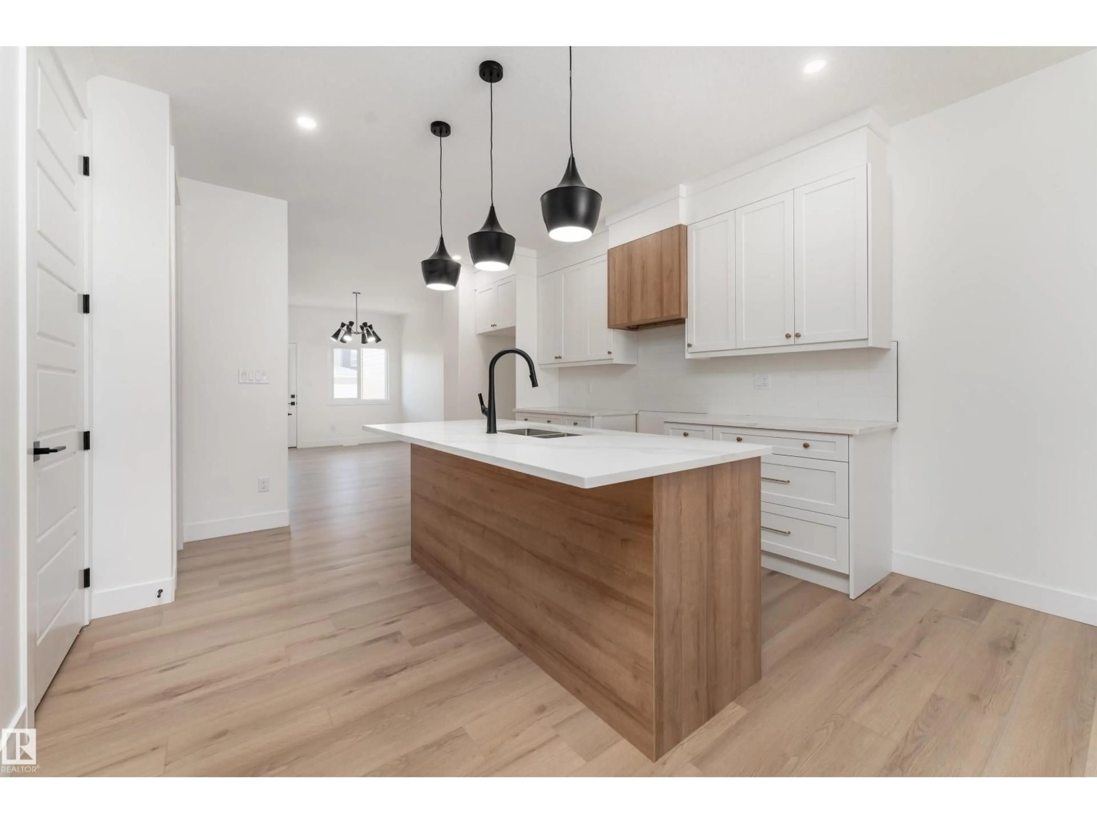 Open concept kitchen, wood/laminate floor for 3117 MAGPIE WY, Edmonton Alberta T5S0V3