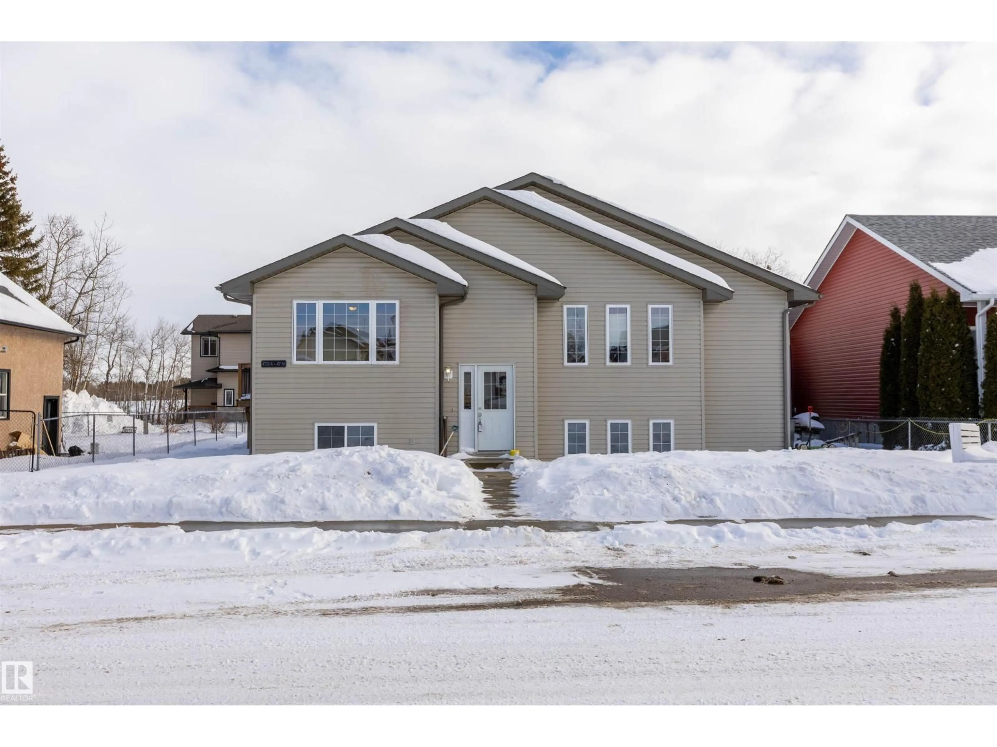 Home with vinyl exterior material, street for 4721A 47 ST, Legal Alberta T0G1L0
