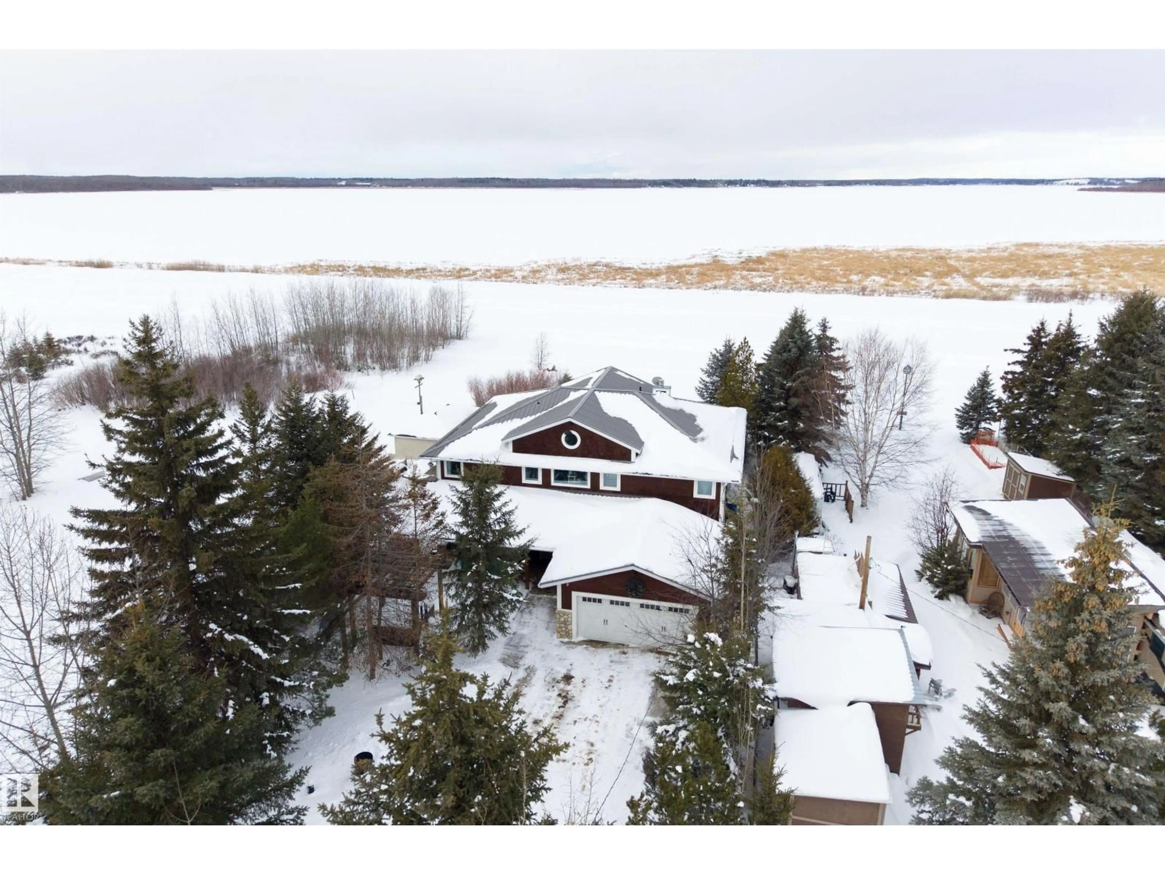 A pic from outside/outdoor area/front of a property/back of a property/a pic from drone, water/lake/river/ocean view for 309 - 55230 RGE ROAD 10, Rural Sturgeon County Alberta T8R0K4