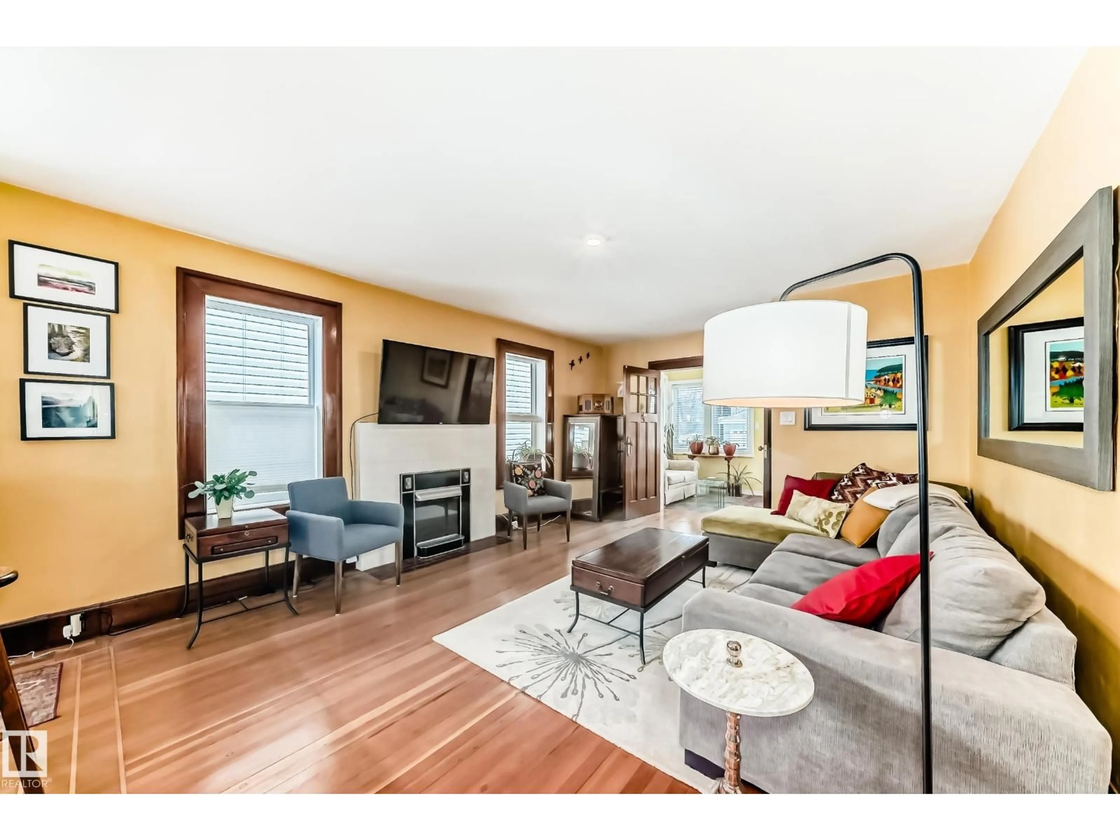 Living room with furniture, wood/laminate floor for 14536 103 AV, Edmonton Alberta T5N0T4