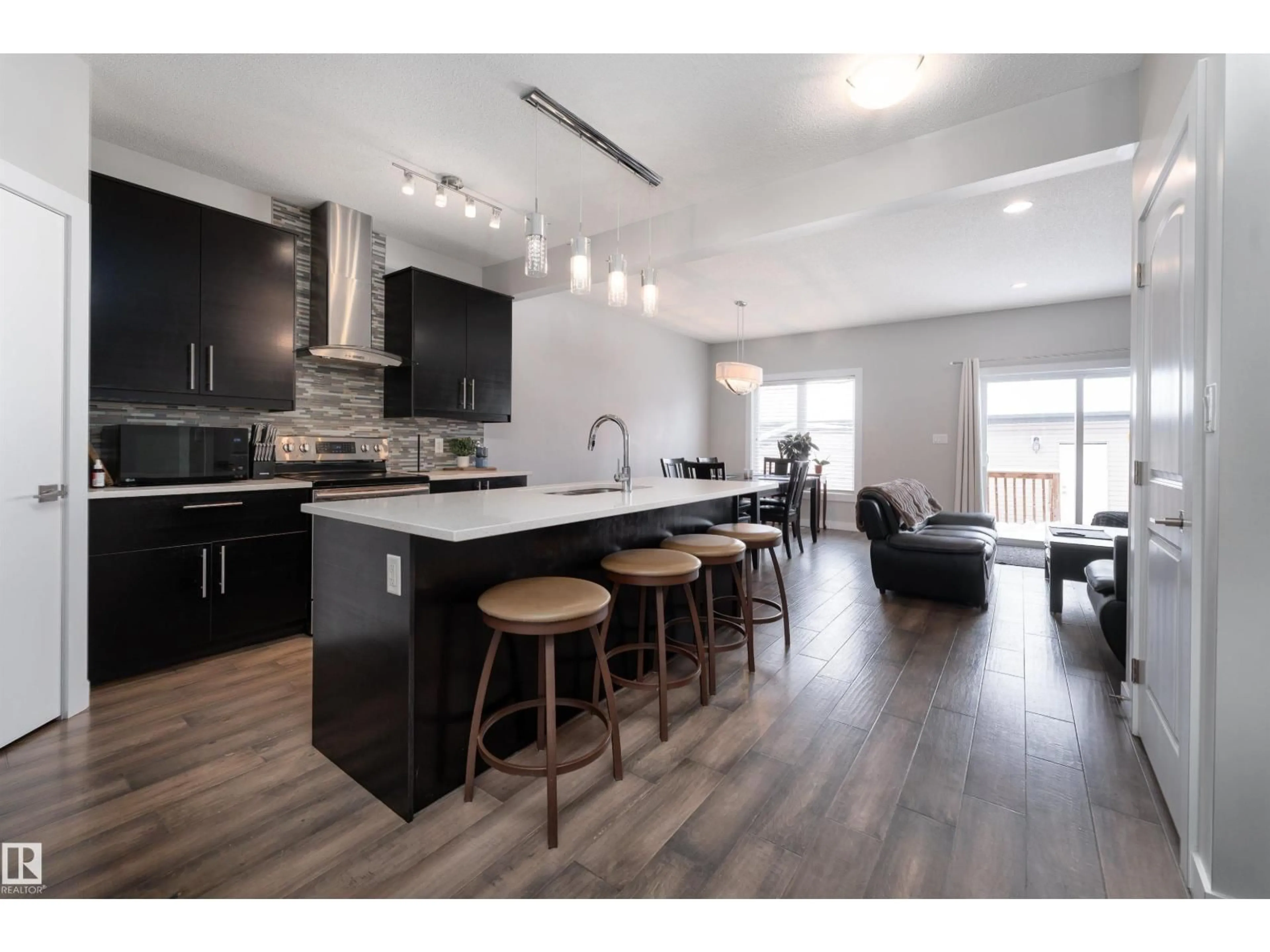 Open concept kitchen, wood/laminate floor for NW - 12024 122 ST, Edmonton Alberta T5L0C6
