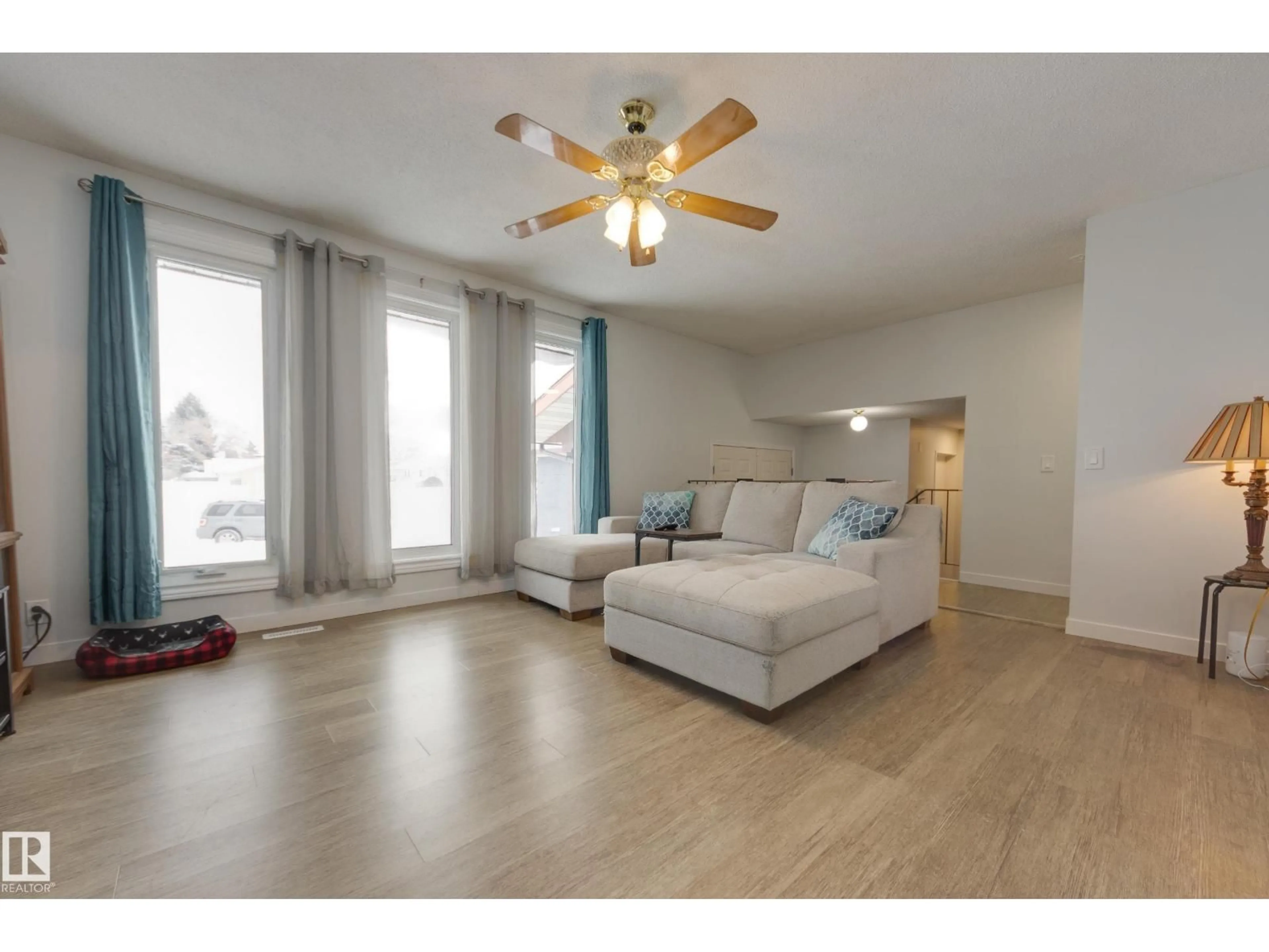 Living room with furniture, wood/laminate floor for 8 HARRISON DR, Edmonton Alberta T5A2R4