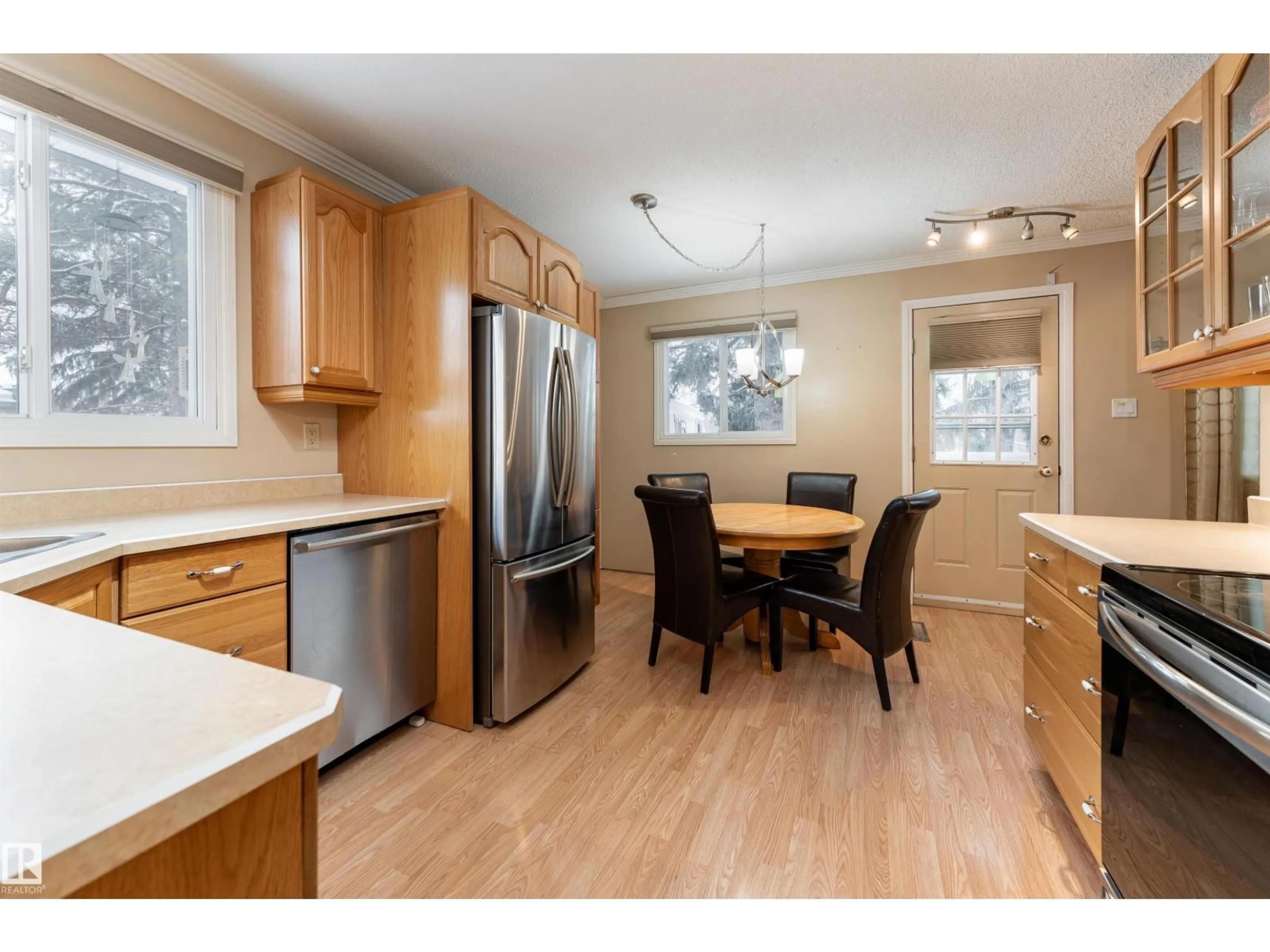 Open concept kitchen, wood/laminate floor for 77 HERON RD, Sherwood Park Alberta T8A0H1