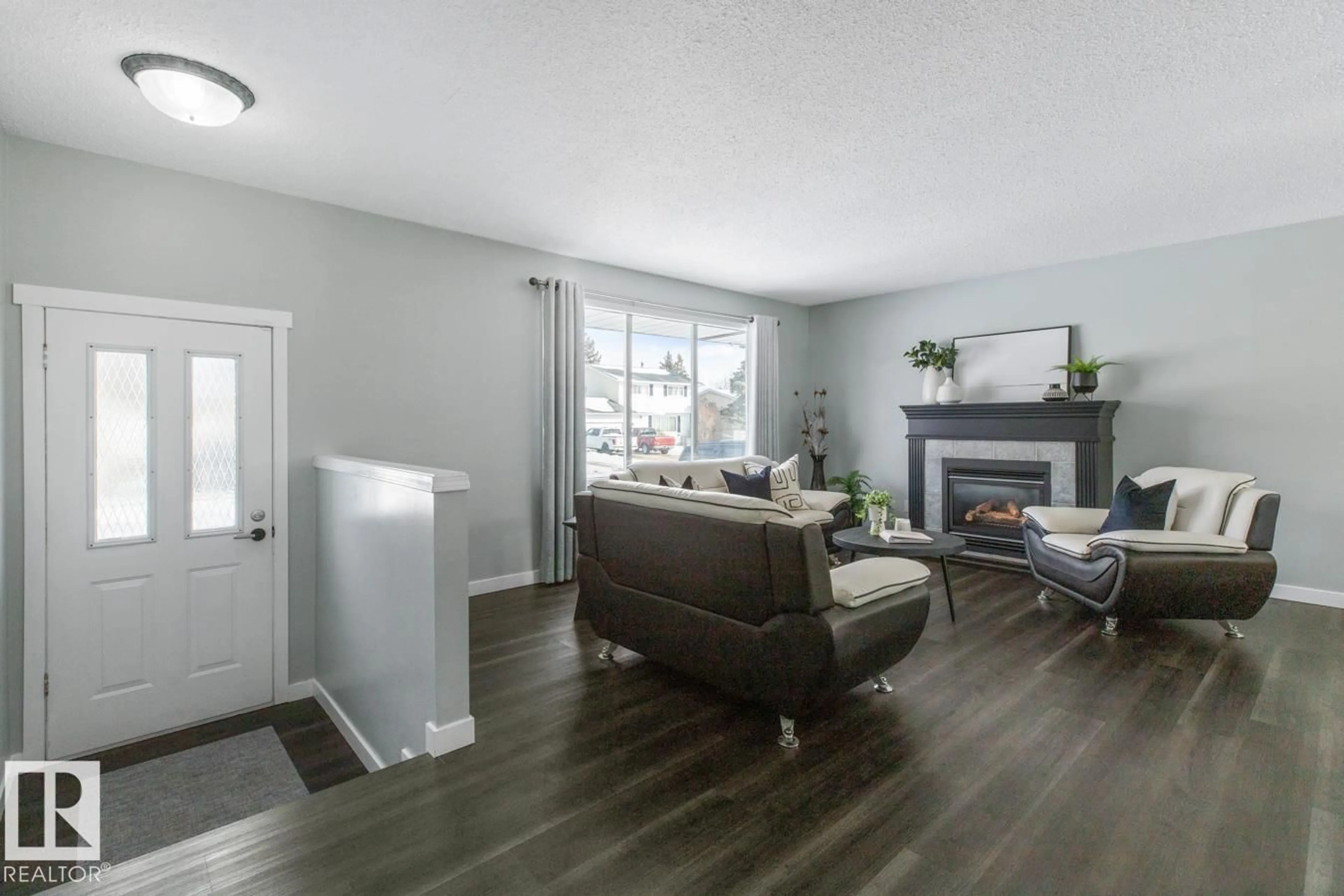 Living room with furniture, wood/laminate floor for 5115 55 AV, Leduc Alberta T9E5M7