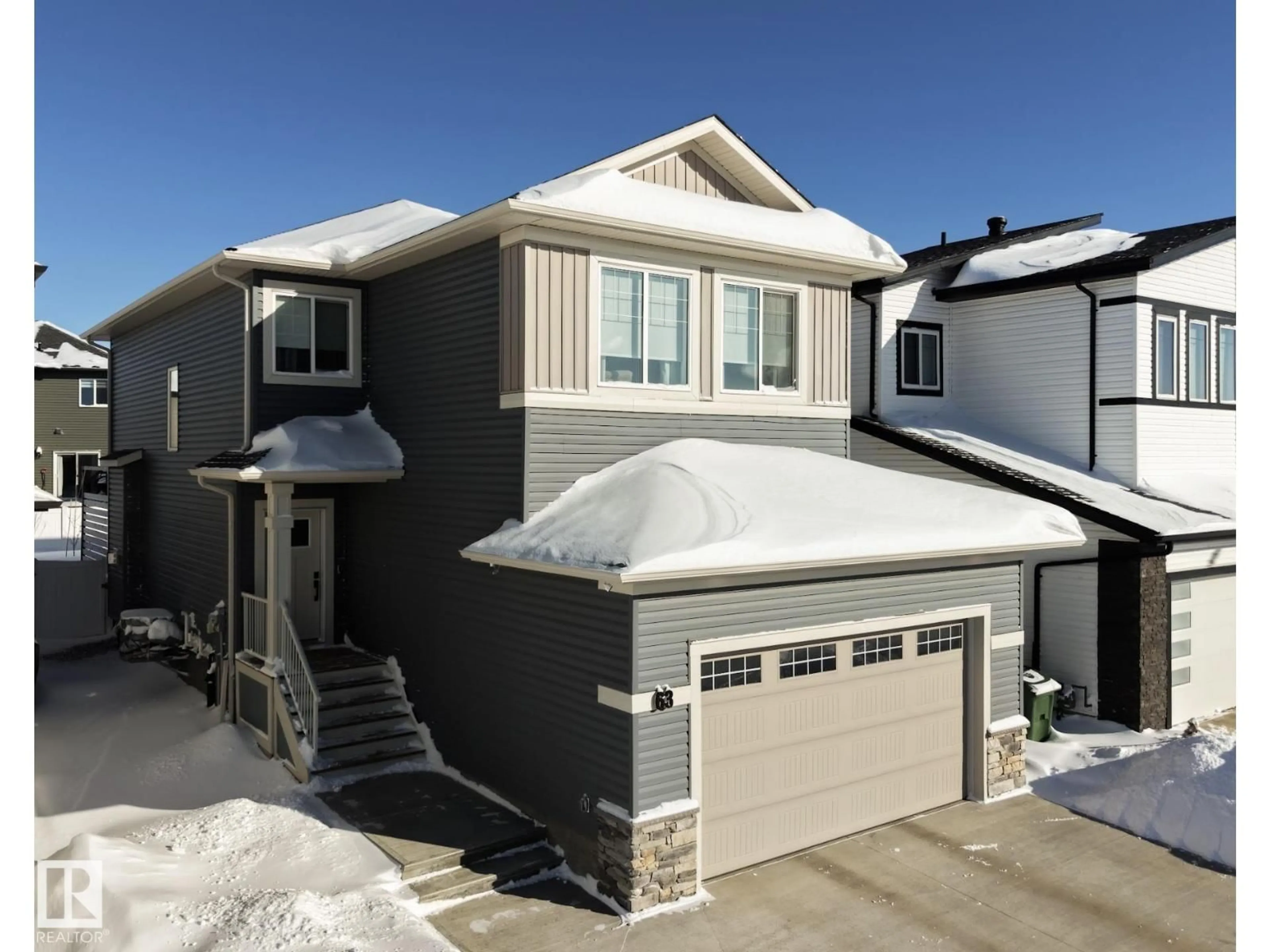 Home with vinyl exterior material, street for 63 WILLOW LI, Fort Saskatchewan Alberta T8L0W8