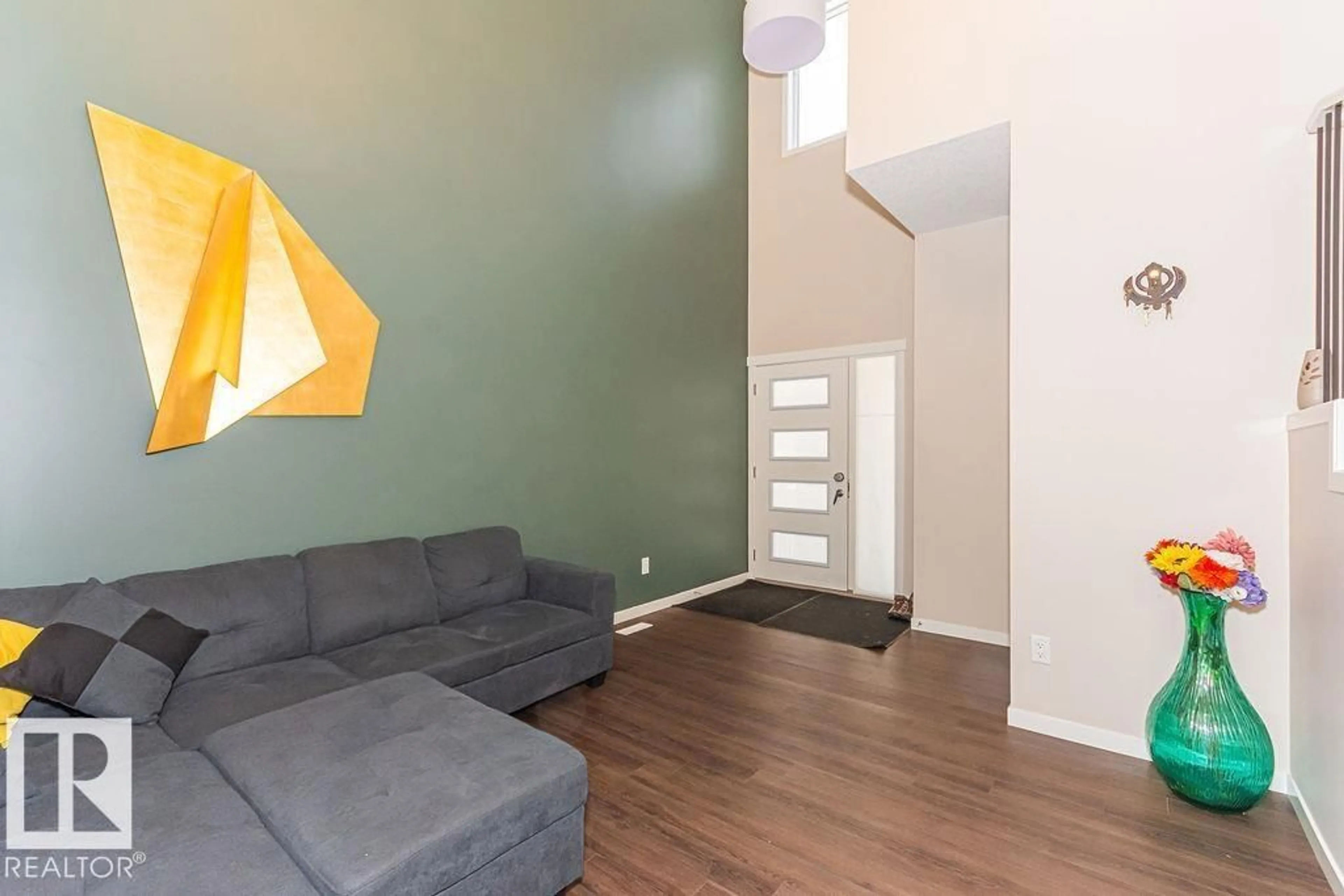 Living room with furniture, wood/laminate floor for 3128 13 AV, Edmonton Alberta T6T0Z3