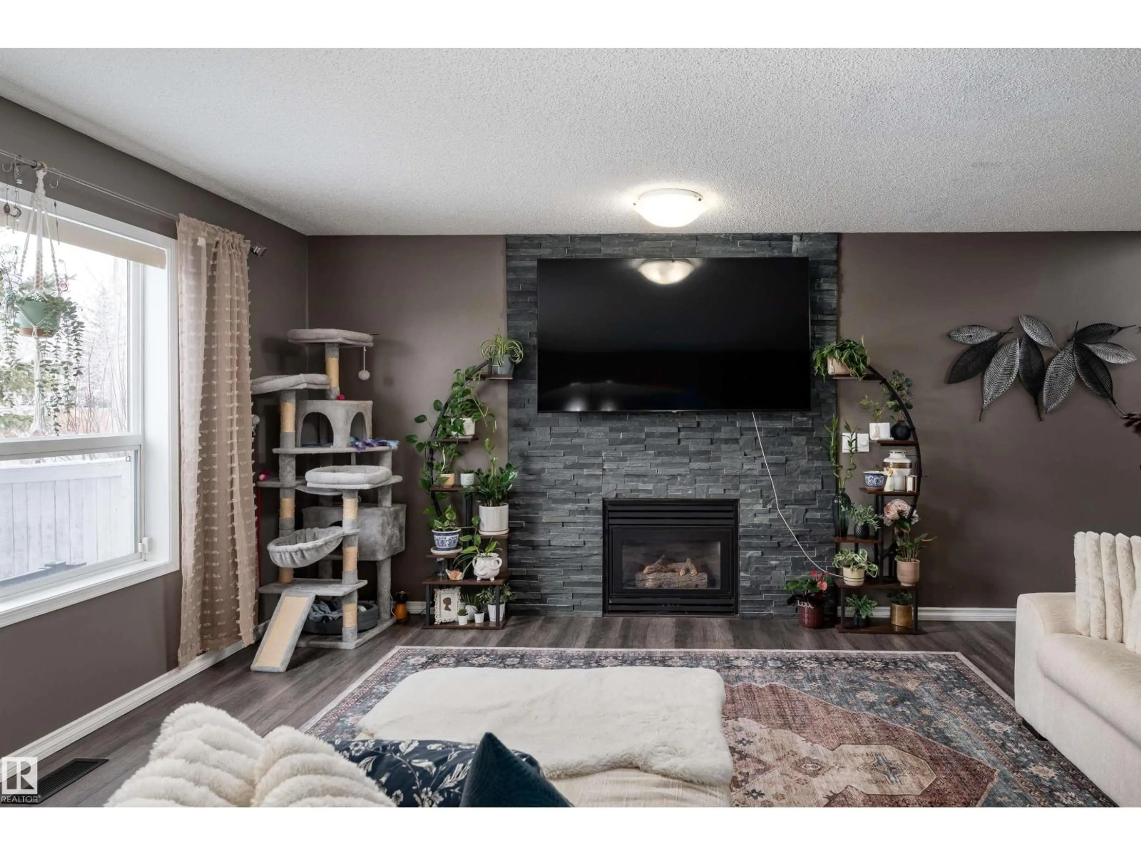Living room with furniture, wood/laminate floor for 31 HAVILAND CR, St. Albert Alberta T8N6P8
