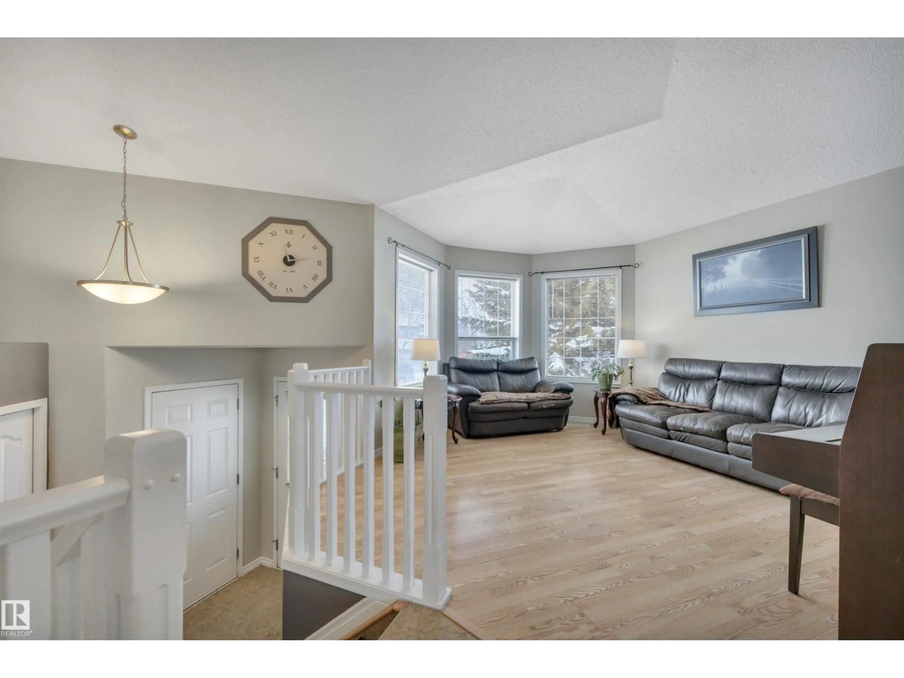 Living room with furniture, wood/laminate floor for 309 FOXBORO PT, Sherwood Park Alberta T8A6C6