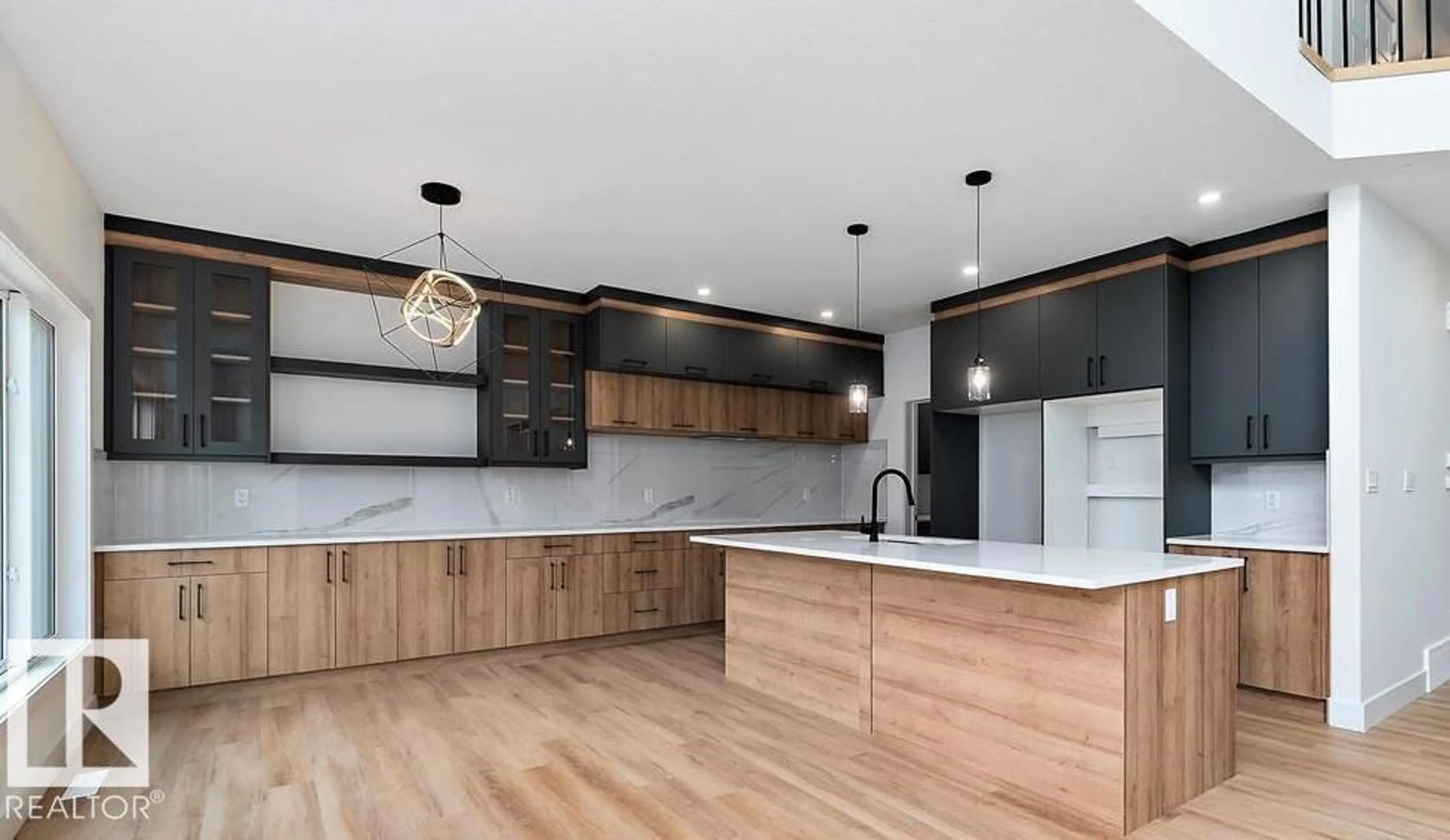 Open concept kitchen, wood/laminate floor for SW - 3311 CHENOWSKI WY, Edmonton Alberta T6W5H2