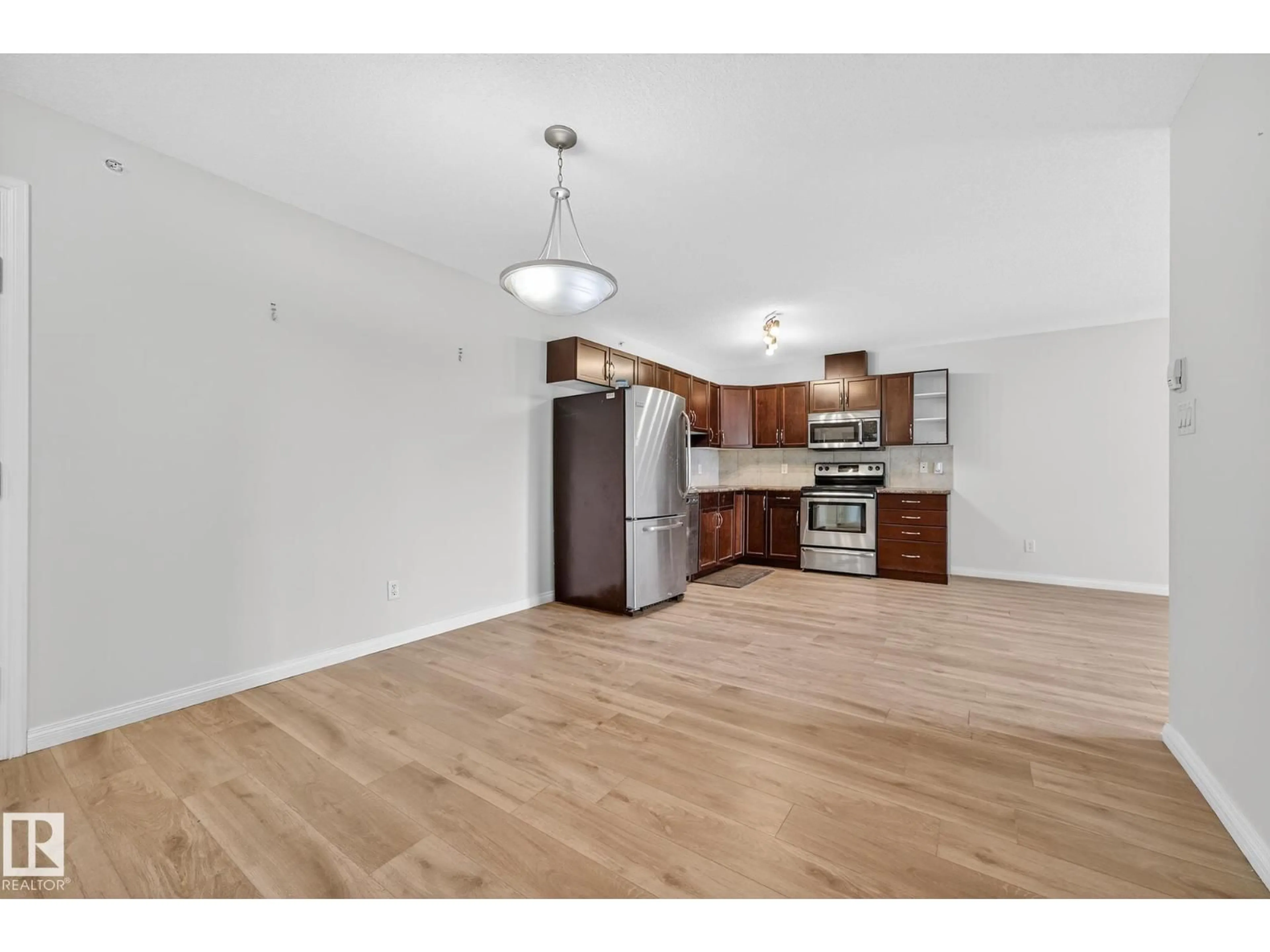 Open concept kitchen, wood/laminate floor for #416 - 1204 156 ST, Edmonton Alberta T6R0R6