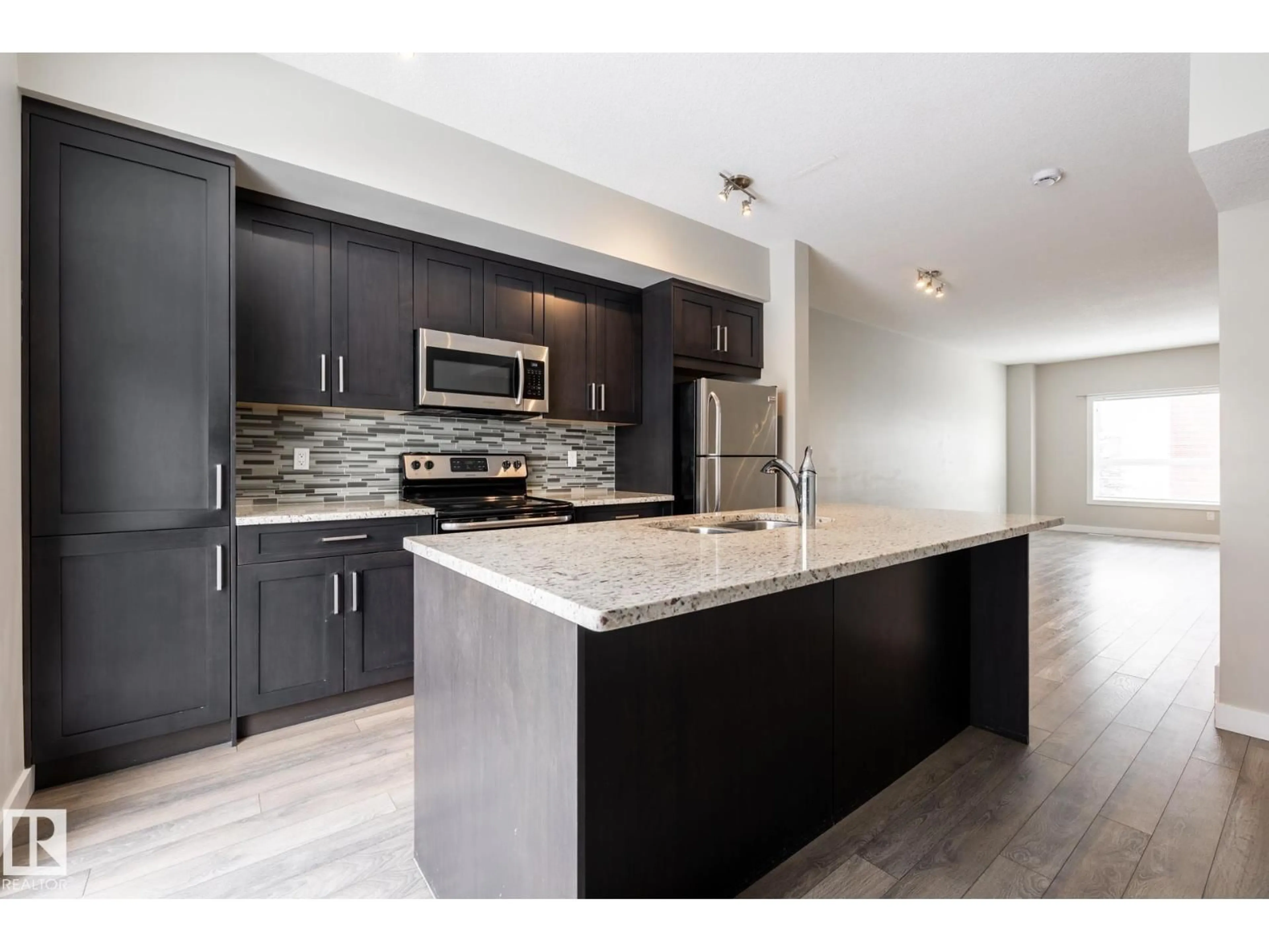 Open concept kitchen, unknown for 127 2560 PEGASUS BV, Edmonton Alberta T5E6V4
