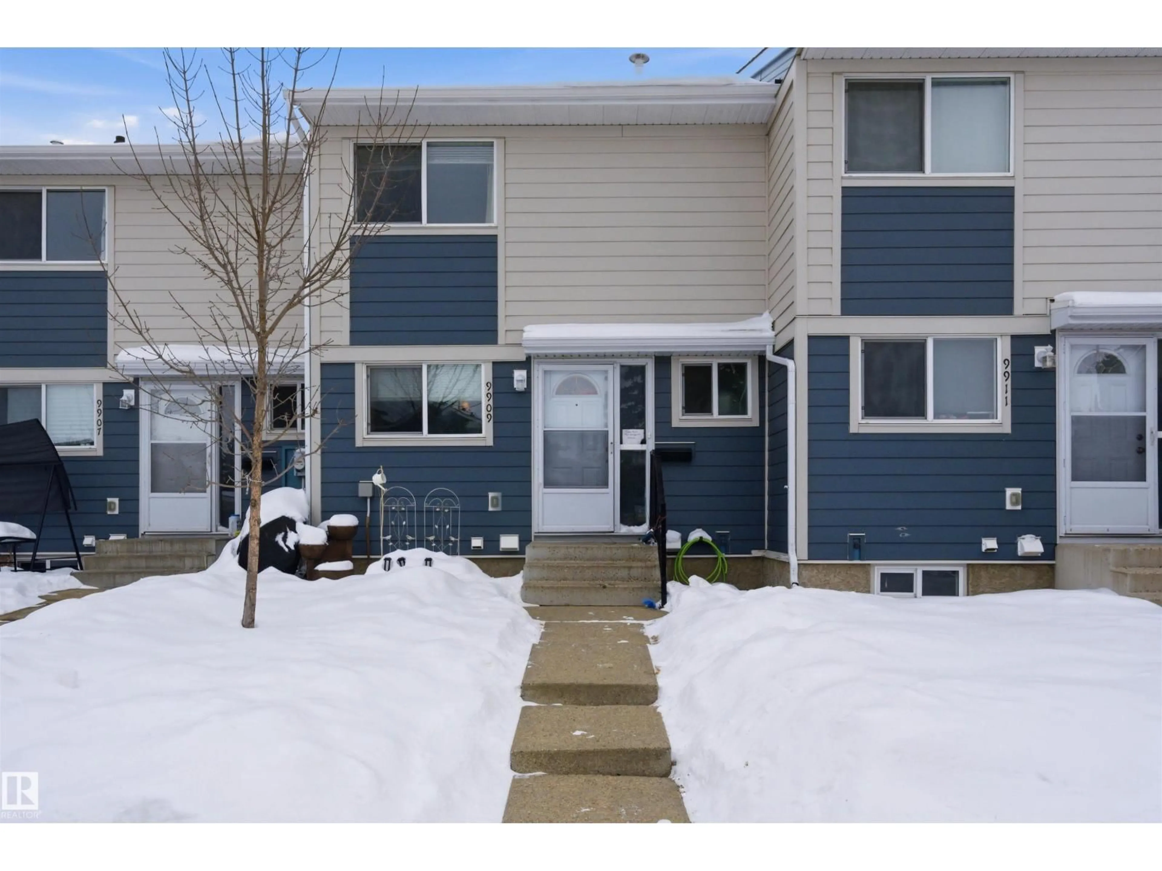 Home with vinyl exterior material, street for 9909 171 AV, Edmonton Alberta T5X4X2