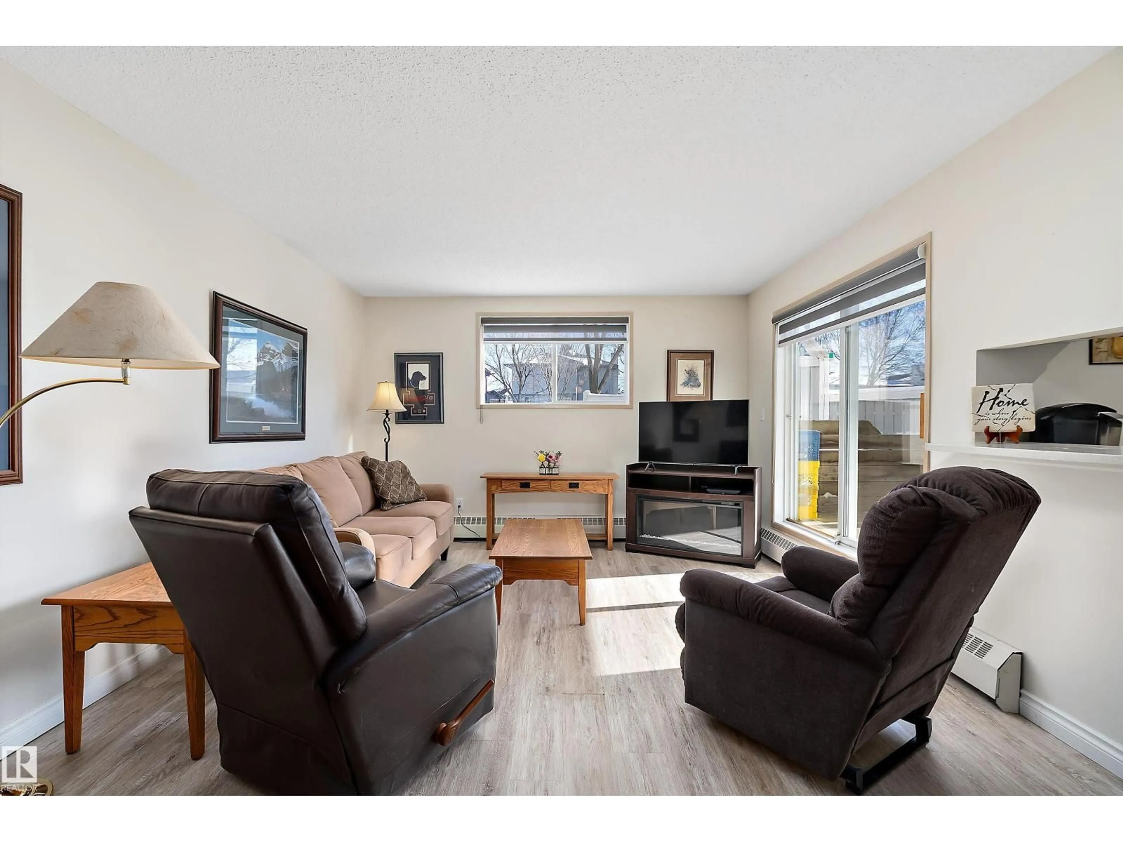 Living room with furniture, wood/laminate floor for 116 - 11620 9A AV, Edmonton Alberta T6J7B4