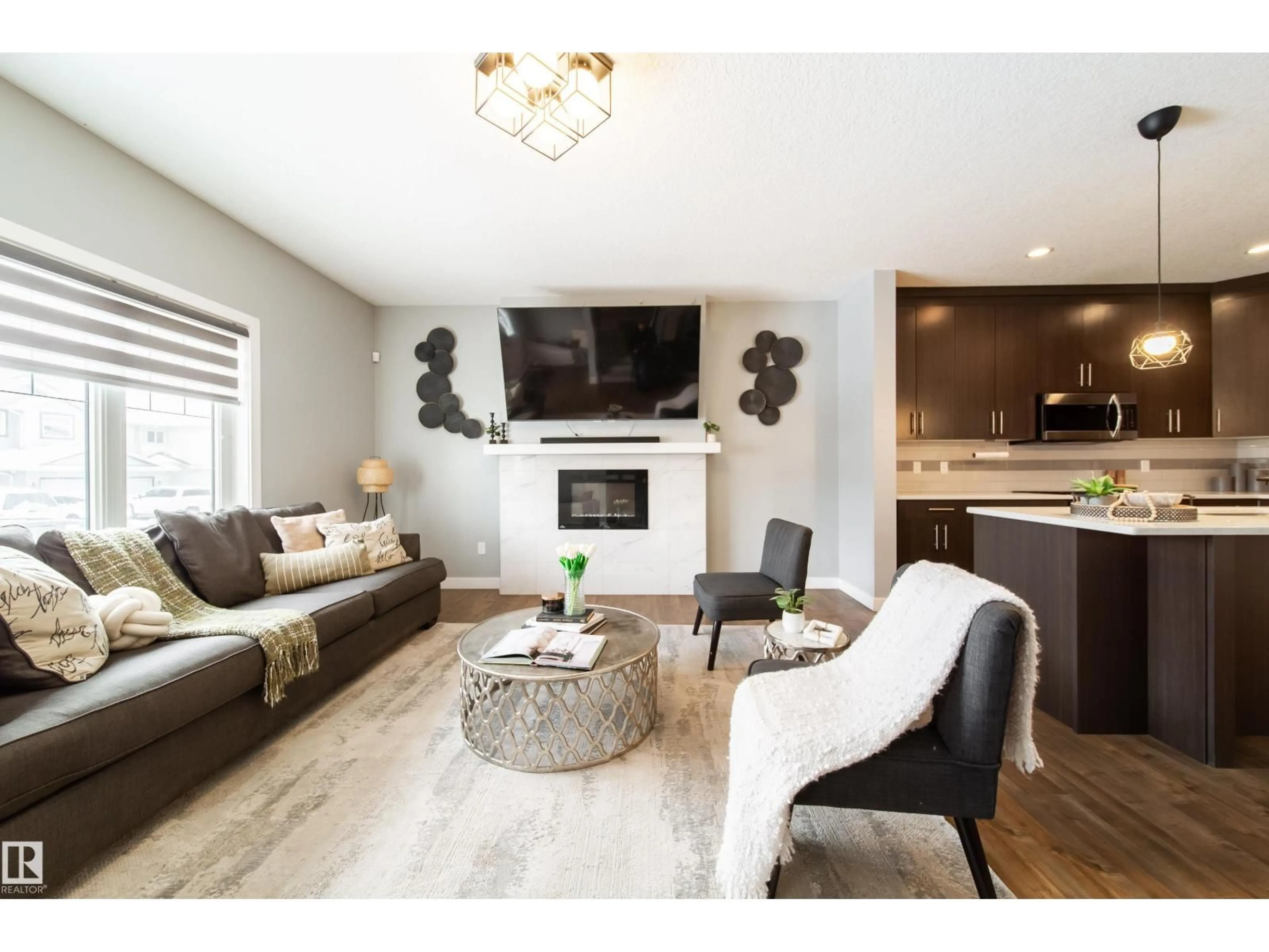 Living room with furniture, wood/laminate floor for 2716 11 ST, Edmonton Alberta T6T0X9