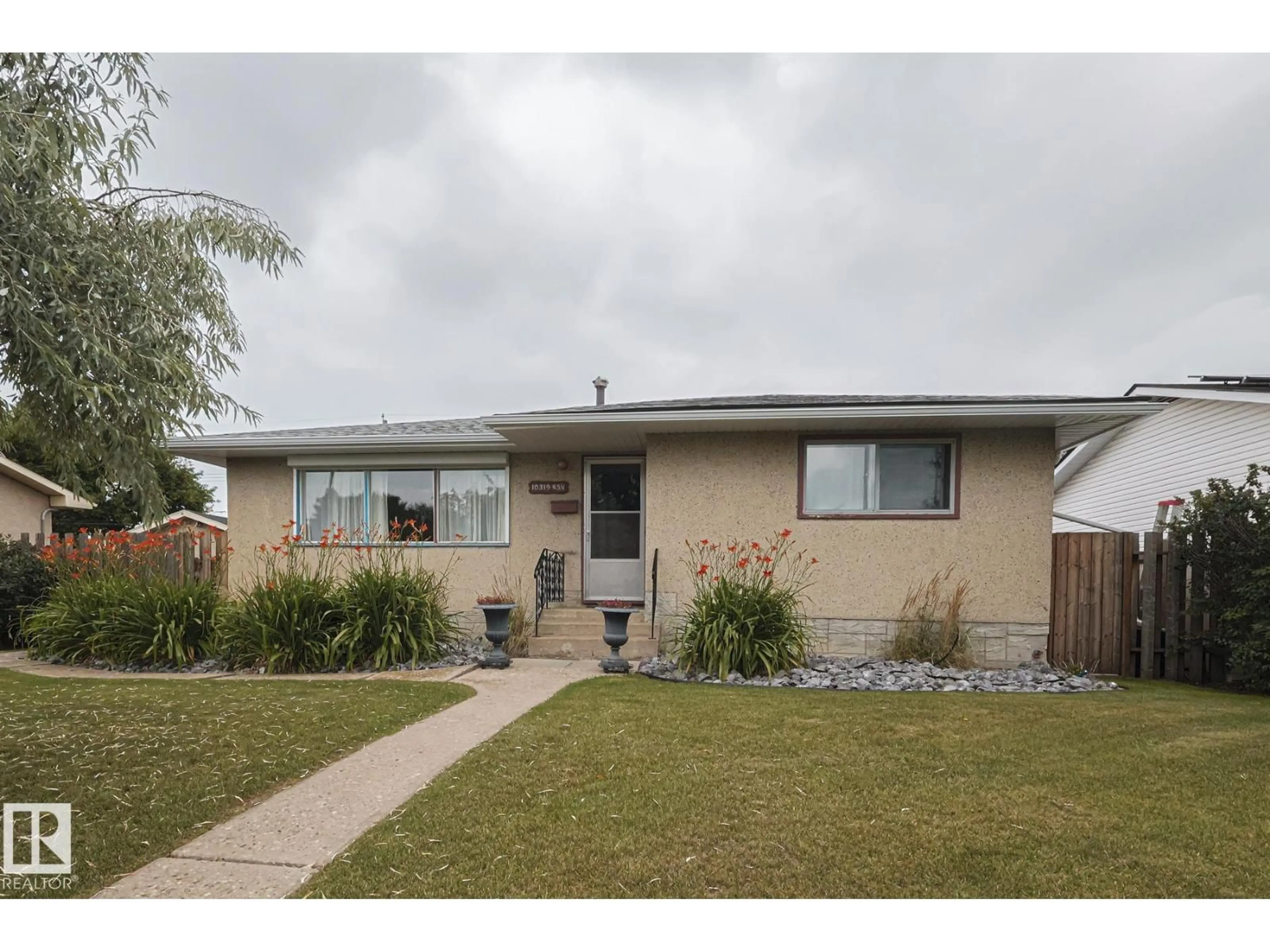 Home with vinyl exterior material, street for NW - 10319 45 ST, Edmonton Alberta T6A1W8