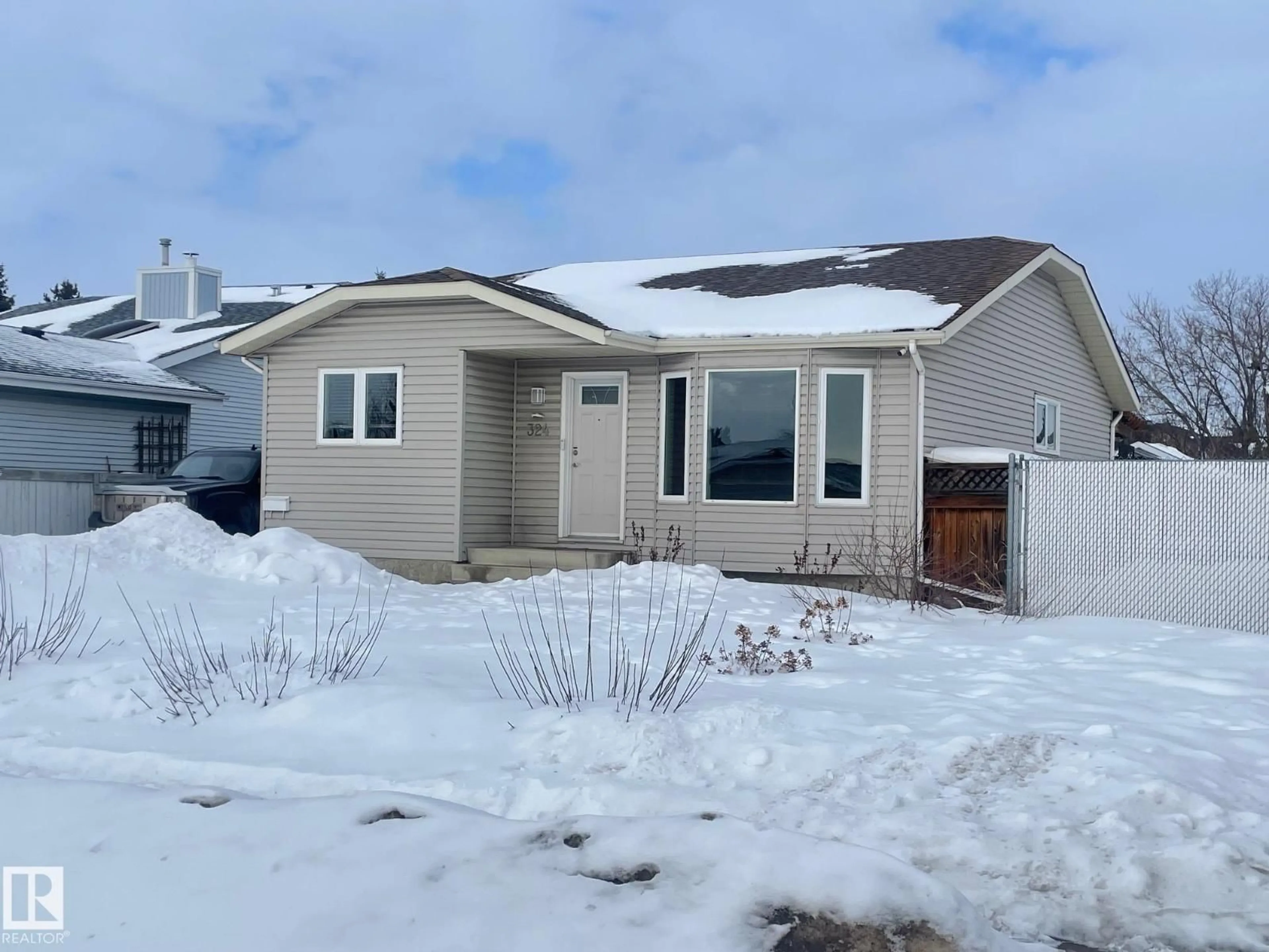 Home with vinyl exterior material, street for 324 WARWICK RD, Edmonton Alberta T5X4P9