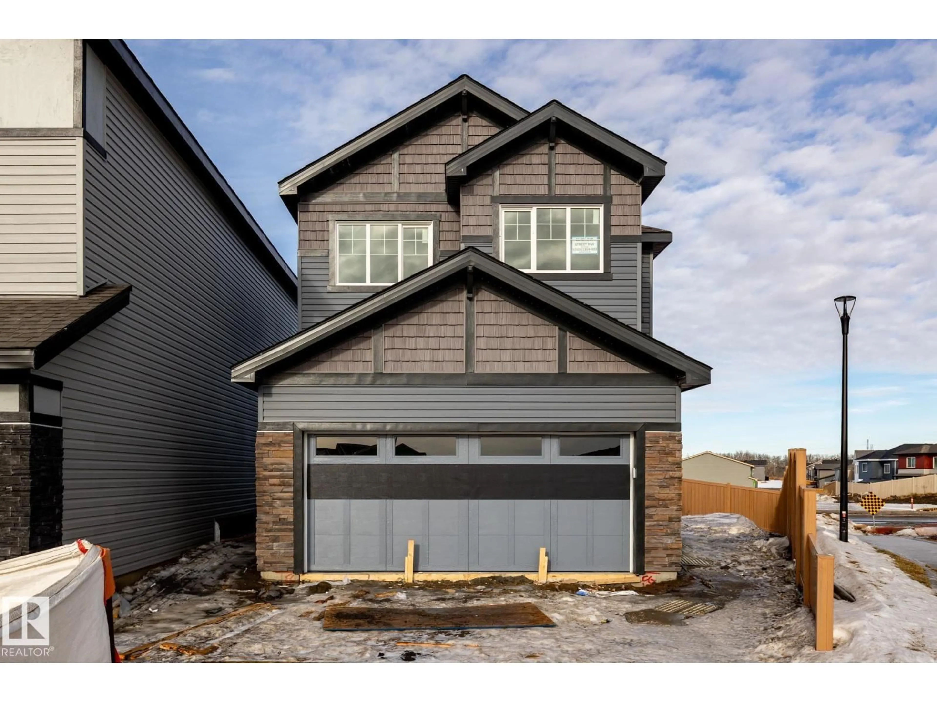 Home with brick exterior material, street for NW - 2148 210 ST, Edmonton Alberta T6M3H7