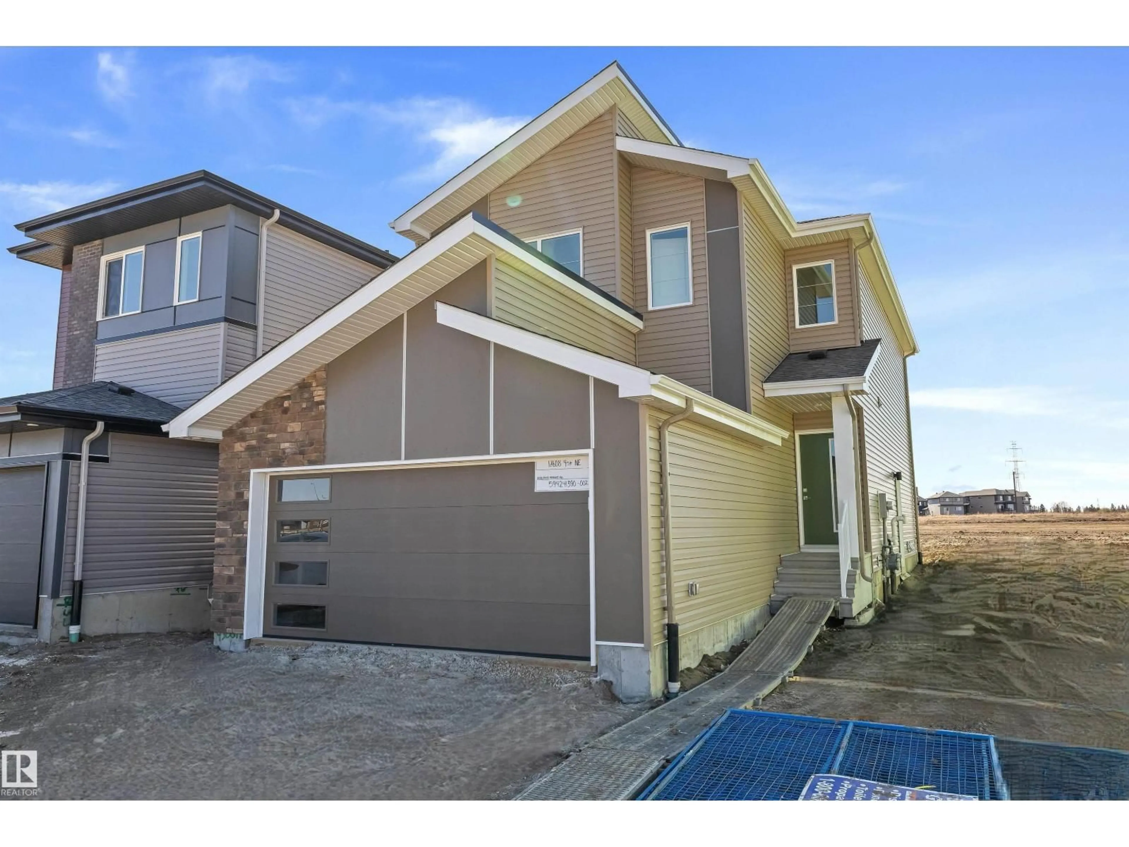 Home with vinyl exterior material, street for NE - 17608 4 ST, Edmonton Alberta T5Y4K6
