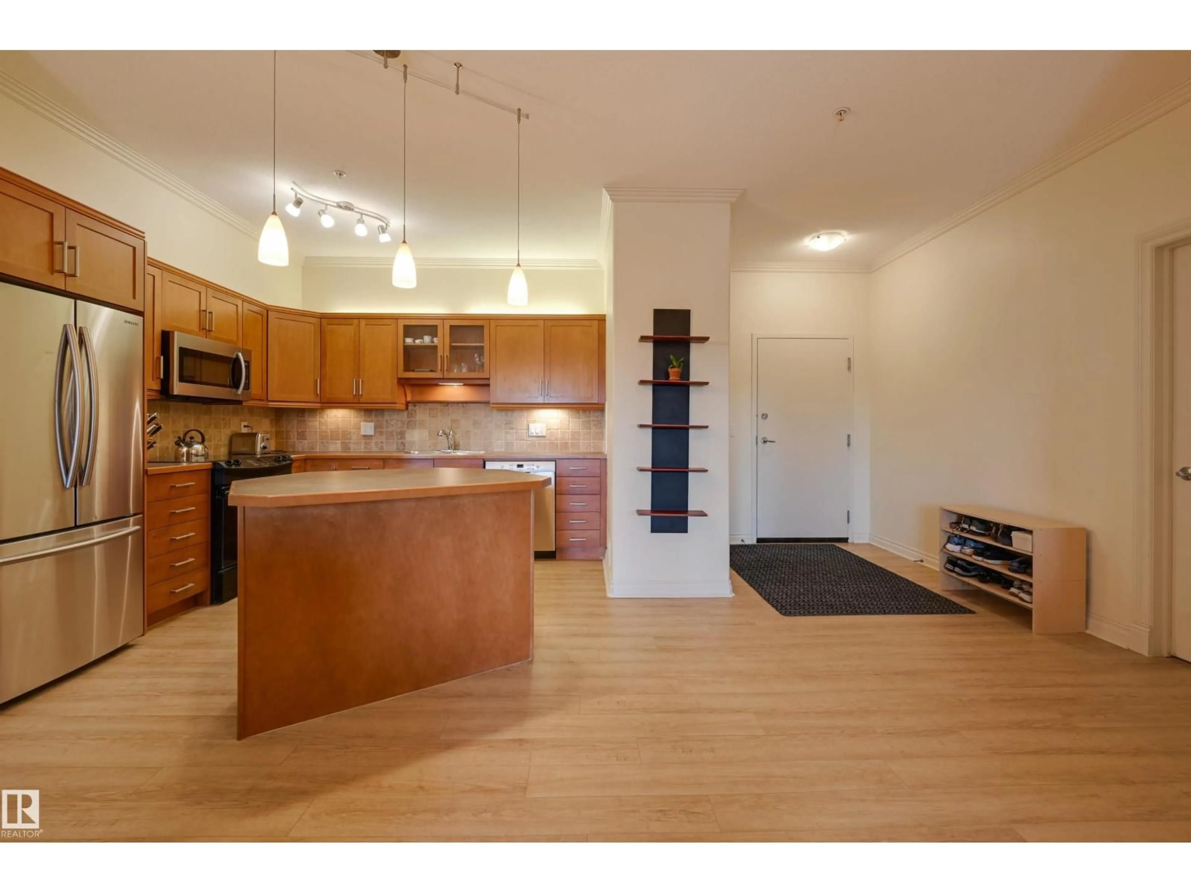 Open concept kitchen, wood/laminate floor for #301 - 14205 96 AV, Edmonton Alberta T5N0C2