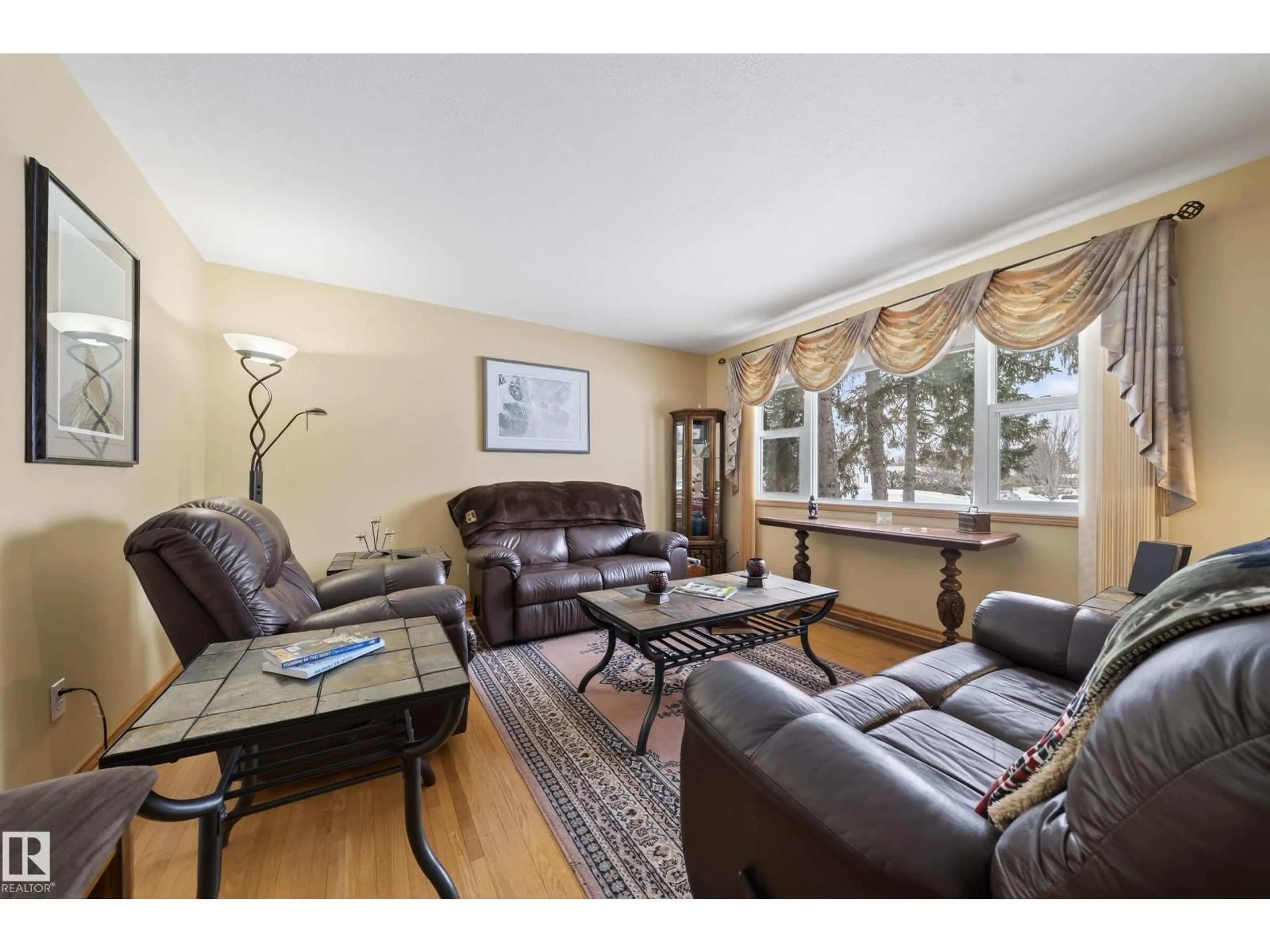 Living room with furniture, wood/laminate floor for 3805 114A ST NW, Edmonton Alberta T6J1N5