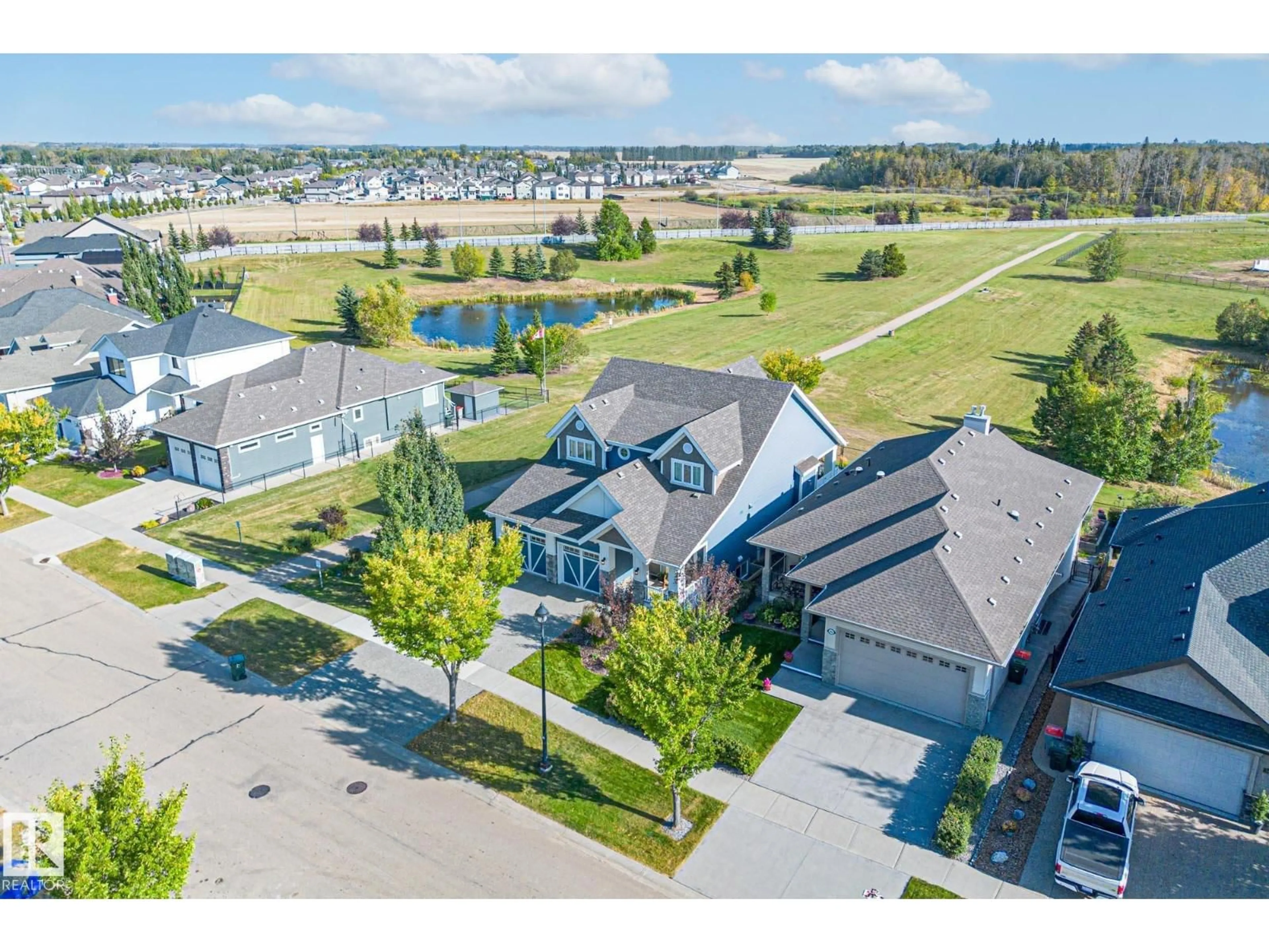 A pic from outside/outdoor area/front of a property/back of a property/a pic from drone, street for 1020 GENESIS LAKE BV, Stony Plain Alberta T7Z0G3