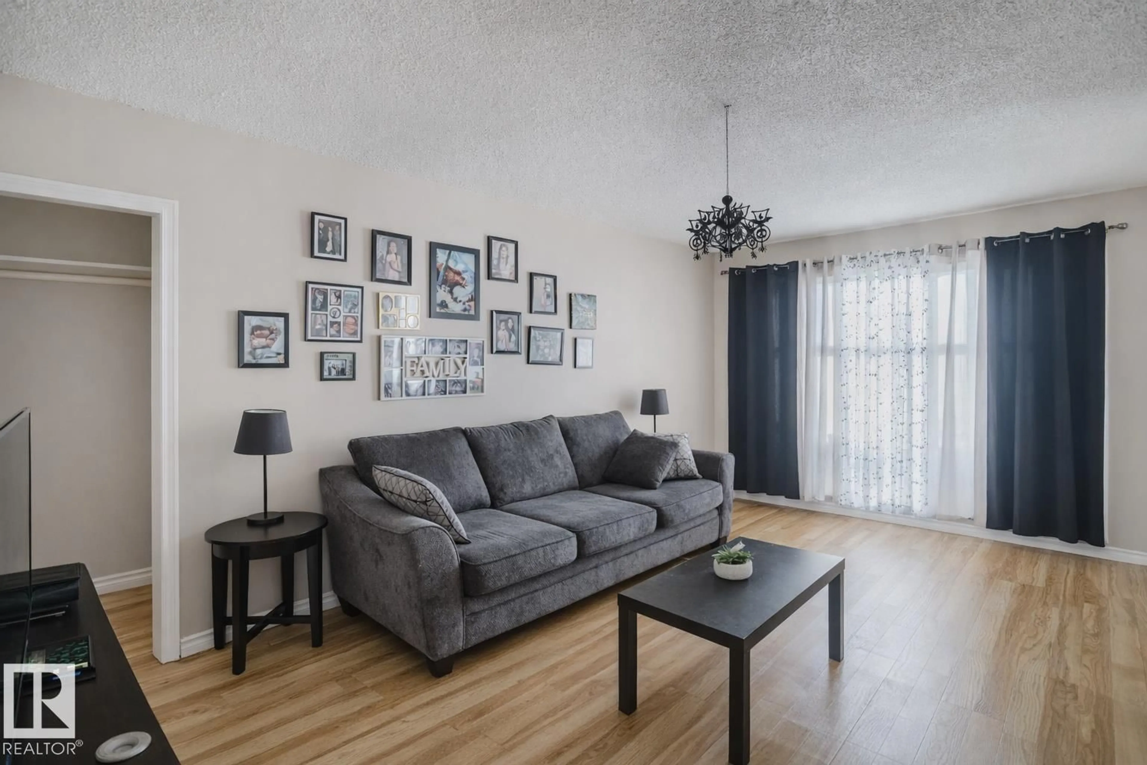 Living room with furniture, wood/laminate floor for 5829 52 ST, Wetaskiwin Alberta T9A2W5