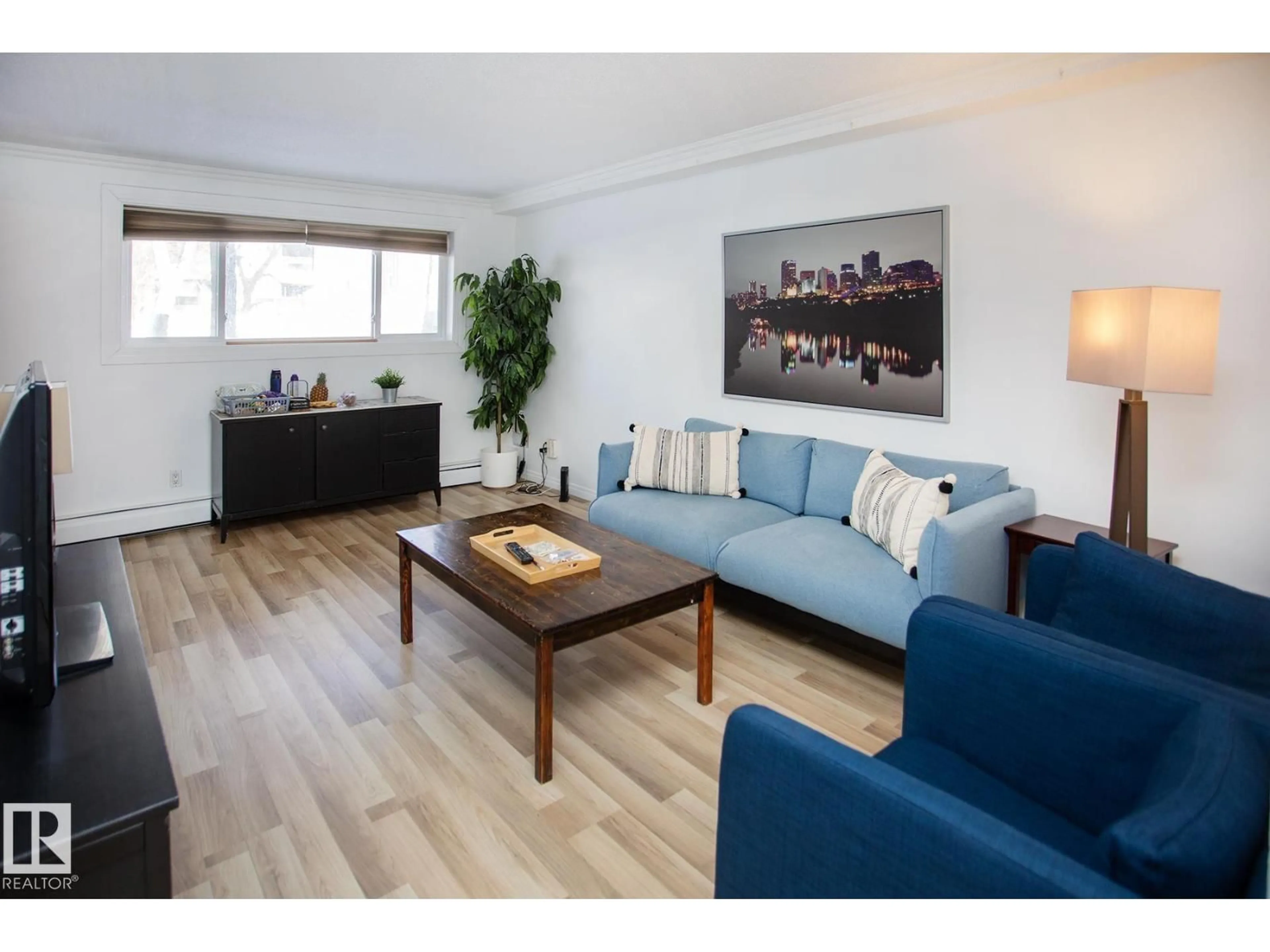 Living room with furniture, wood/laminate floor for #104 - 9925 83 AV, Edmonton Alberta T6E2B9