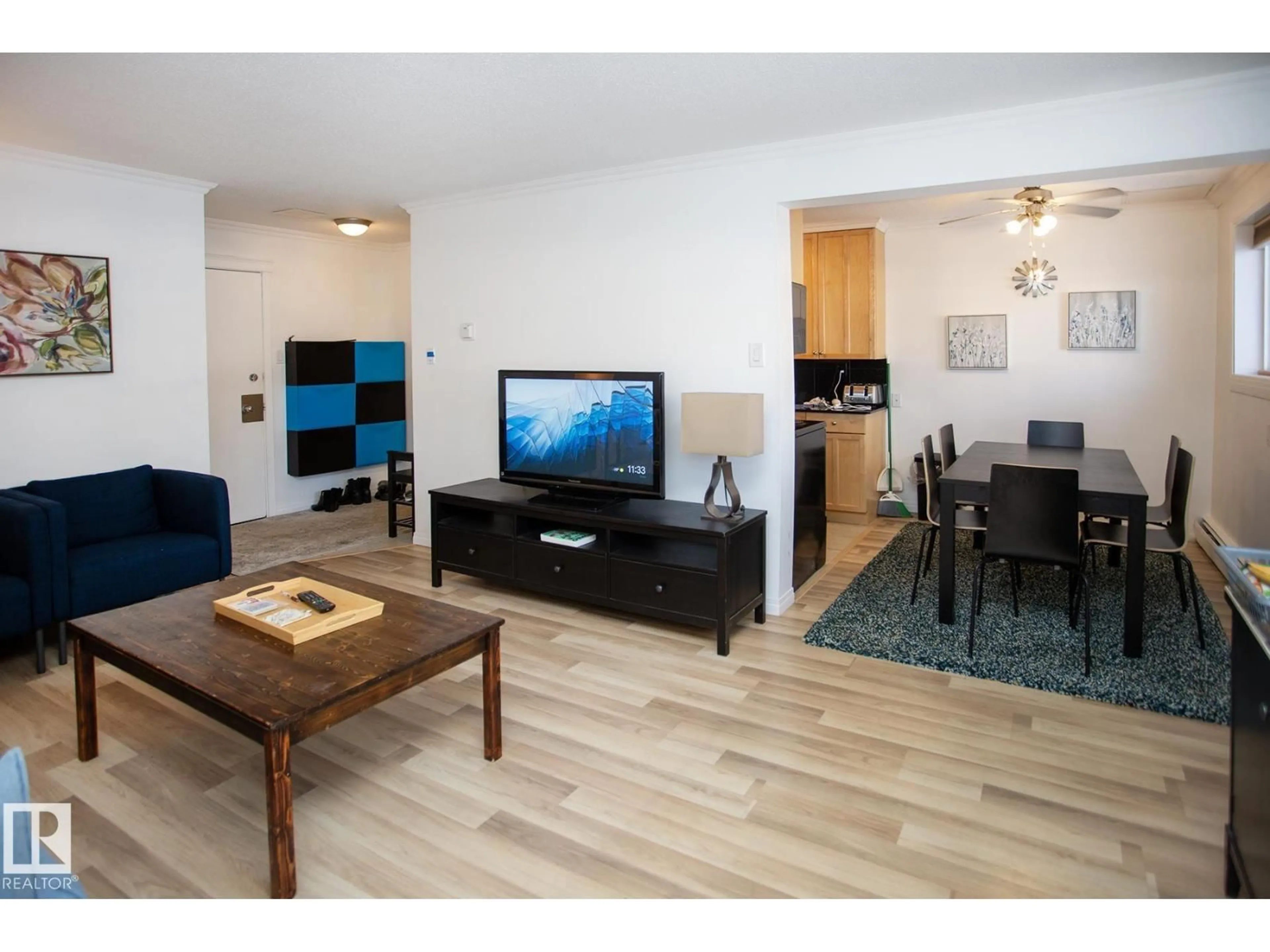 Living room with furniture, wood/laminate floor for #104 - 9925 83 AV, Edmonton Alberta T6E2B9