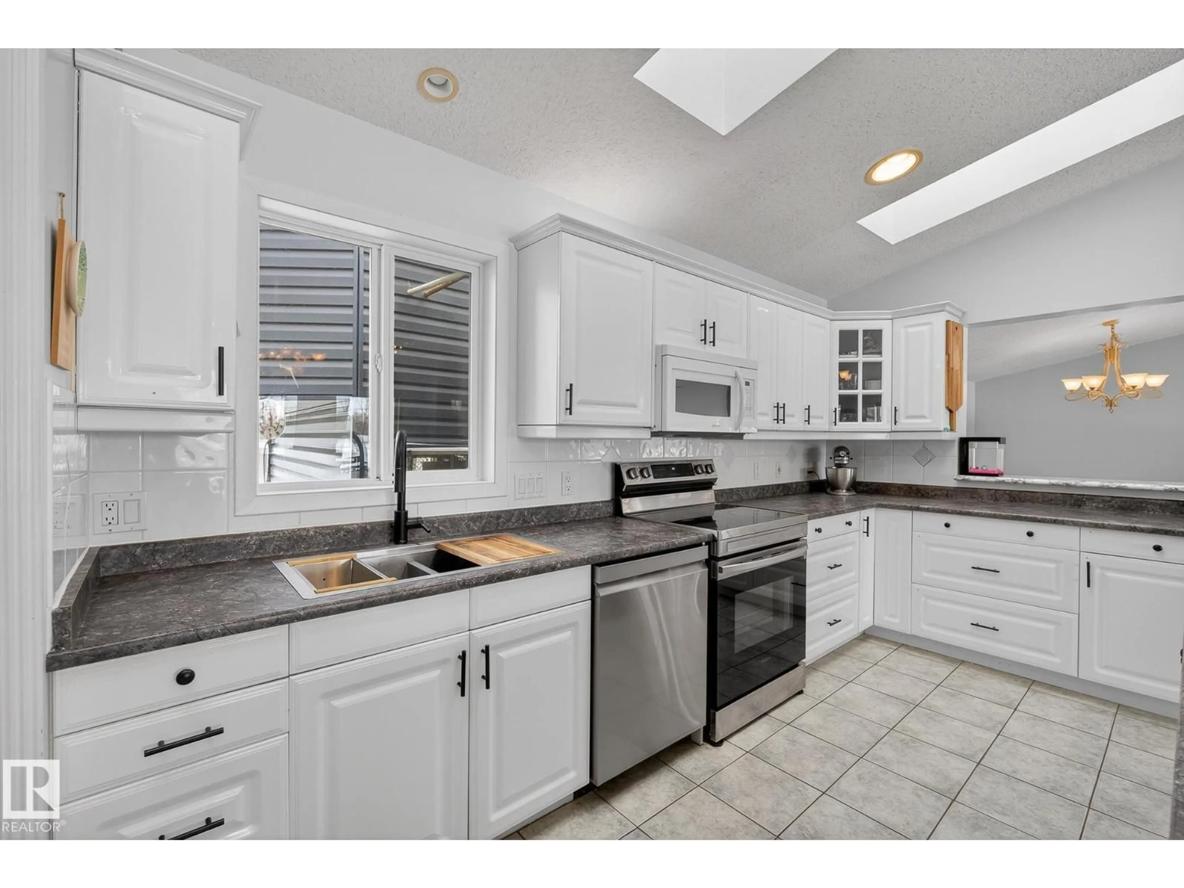 Open concept kitchen, ceramic/tile floor for 25206 SH 651, Rural Sturgeon County Alberta T0G1L1