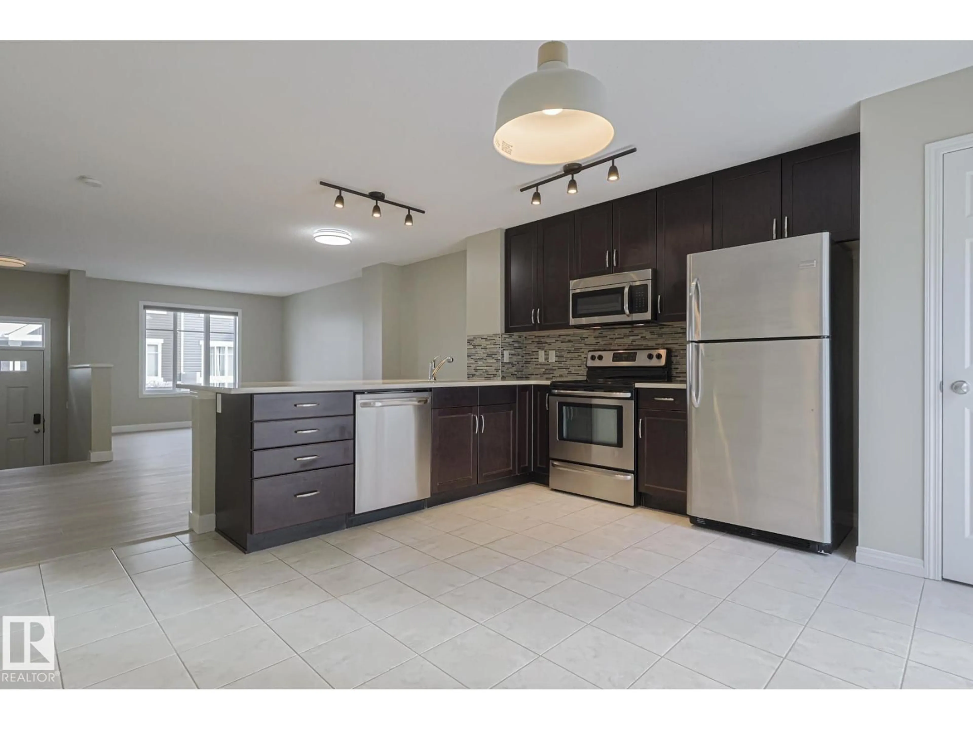 Open concept kitchen, ceramic/tile floor for #131 - 2905 141 ST, Edmonton Alberta T6W3M4